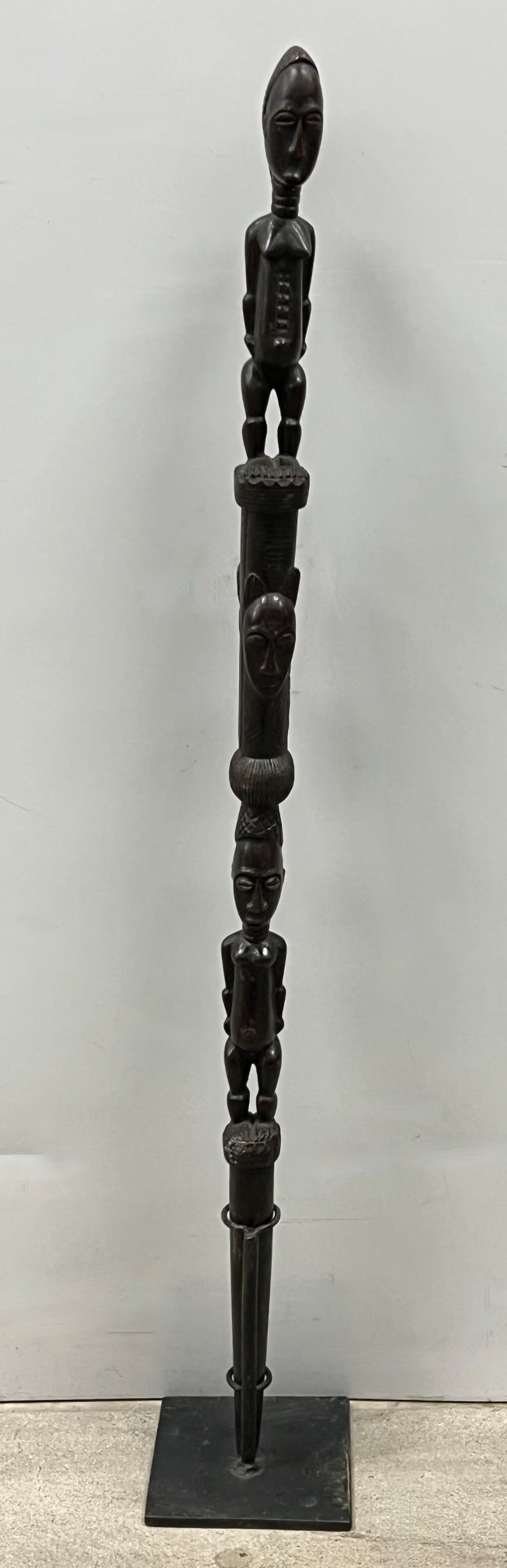 Baule Stick with Metal Stand: African Tribal Art Baule Stick with Metal stand. The dimension is 34 inches high x 2.5 inches wide. Please be aware that some of the items are vintage, secondhand, old ages, antiques and may have a de