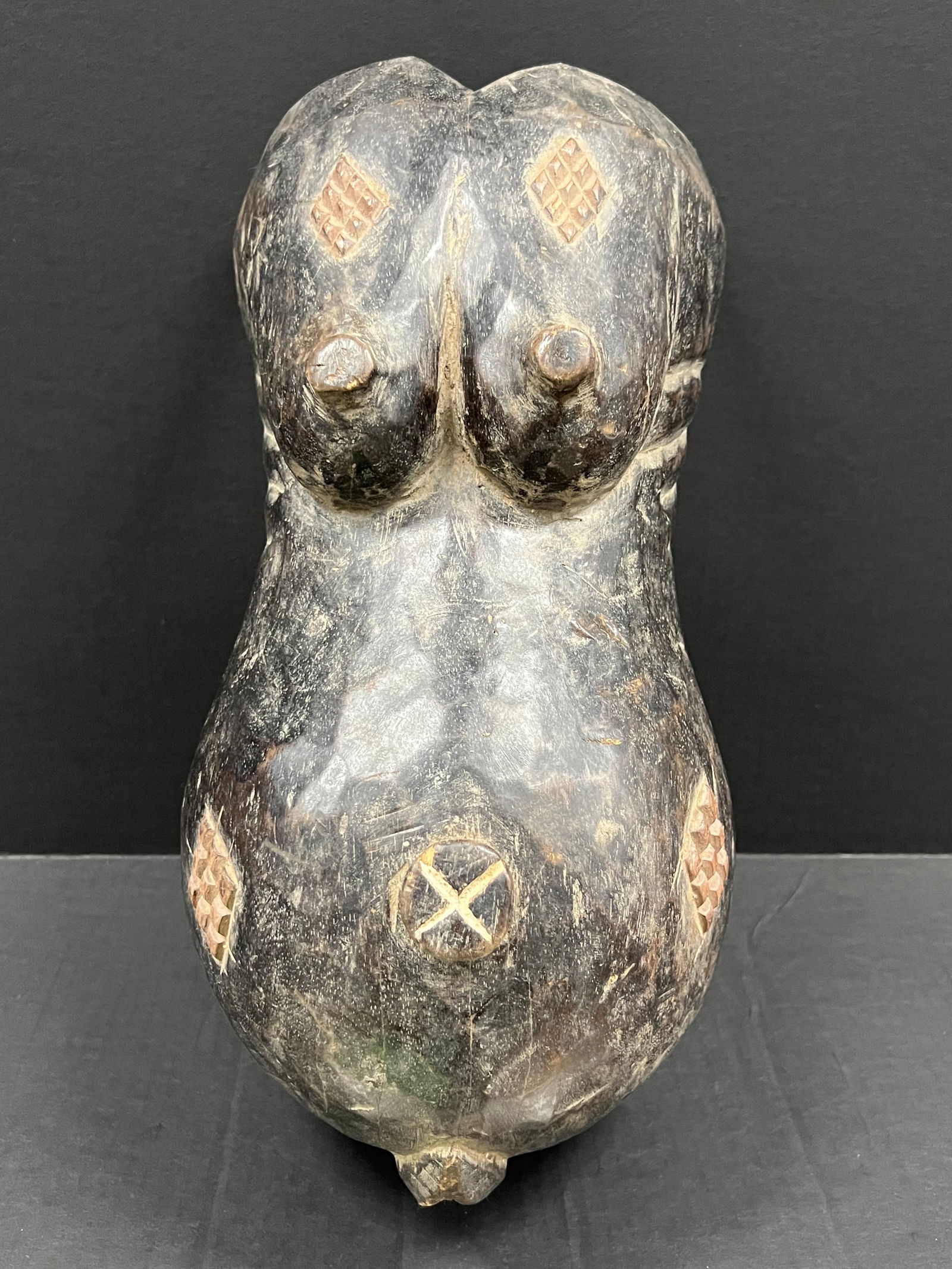 Makonde Body Belly Mask: African Tribal Art Makonde Body Belly Mask. The dimension is 17 inches high x 8.5 inches wide. Please be aware that some of the items are vintage, secondhand, old ages, antiques and may have a defects