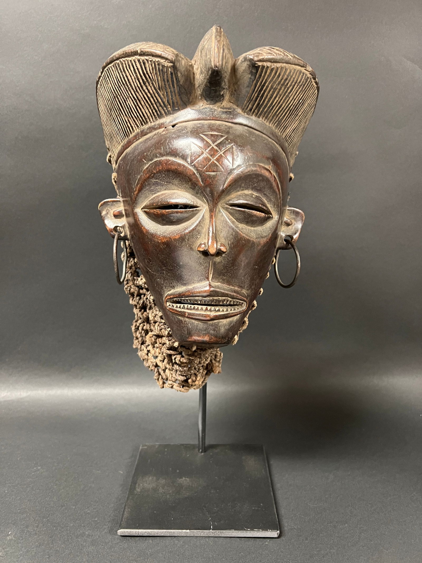 Chokwe Mask with Display Stand: African Tribal Art Chokwe Mask with Display Stand. The dimension is 16 inches high x 8 inches wide. Please be aware that some of the items are vintage, secondhand, old ages, antiques and may have a de