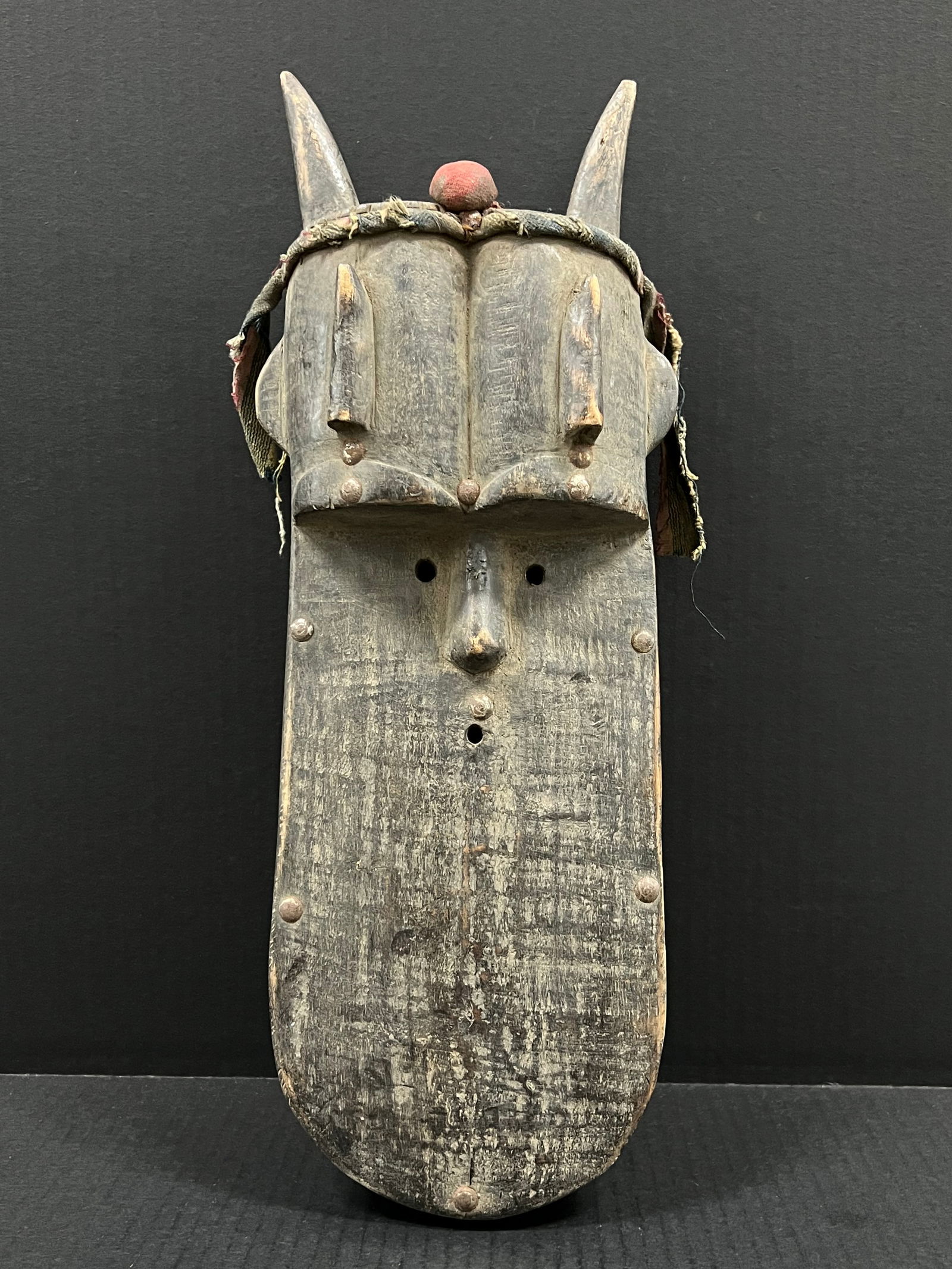 Toma Mask: African Tribal Art Toma Mask. The dimension is 17.5 inches high x 7 inches wide. Please be aware that some of the items are vintage, secondhand, old ages, antiques and may have a defects or sign of ag