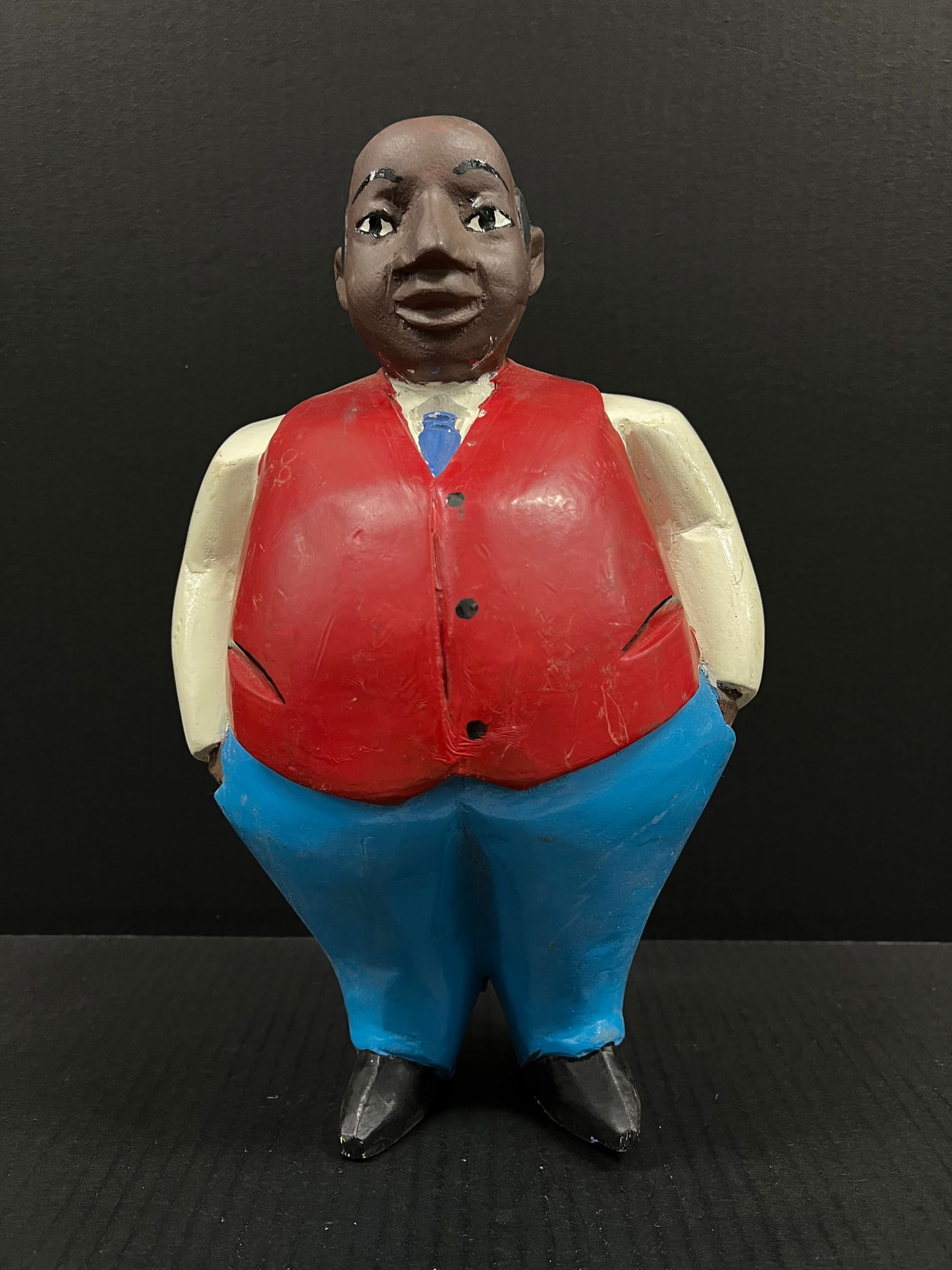 Colonial Statue: African Tribal Art Colonial Statue. The dimension is 12 inches high x 7.75 inches wide. Please be aware that some of the items are vintage, secondhand, old ages, antiques and may have a defects or sig