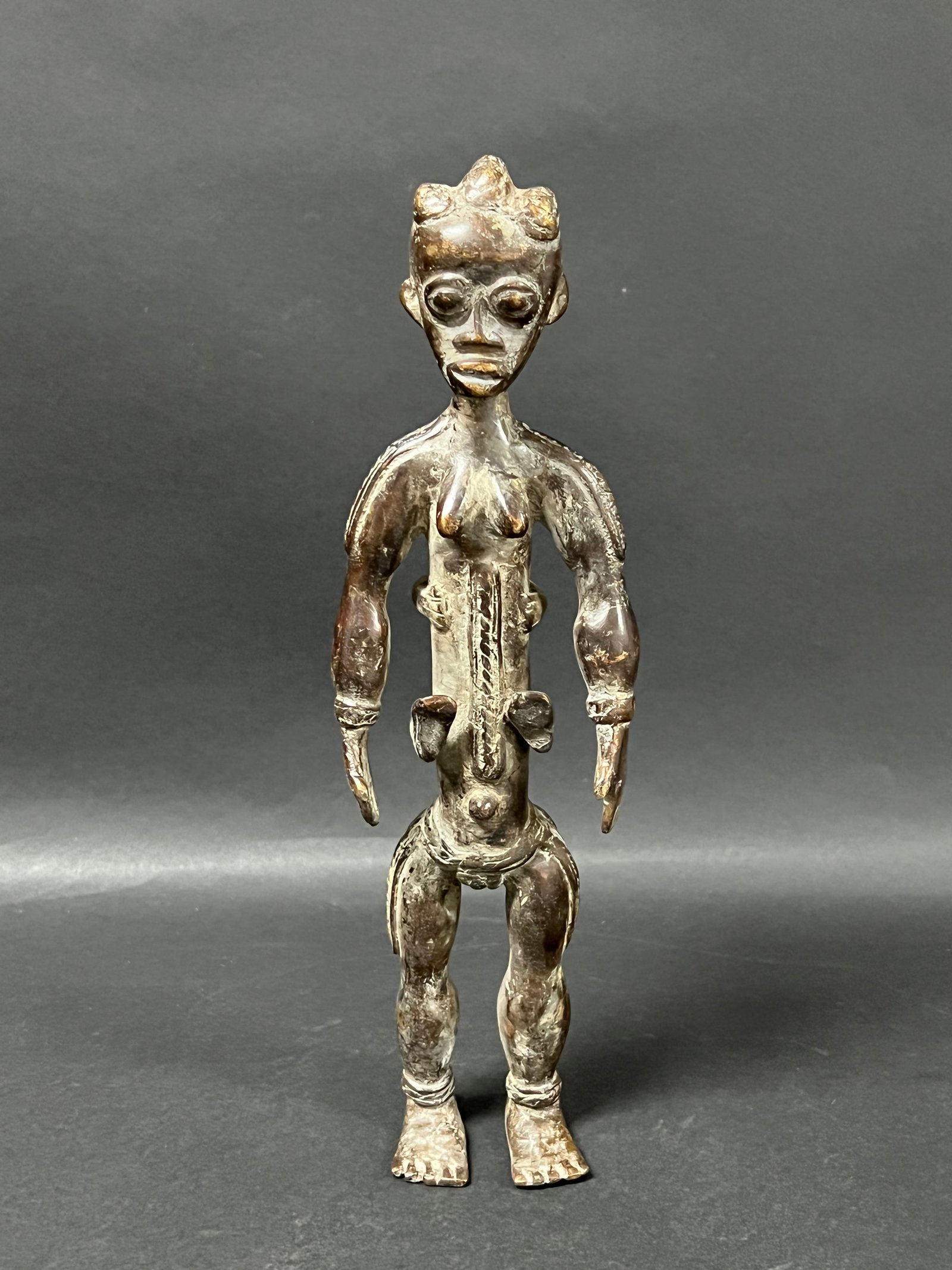Attye Bronze Maternity Statue: African Tribal Art Attye Bronze Maternity Statue. The dimension is 11.5 inches high x 3.5 inches wide. Please be aware that some of the items are vintage, secondhand, old ages, antiques and may have a