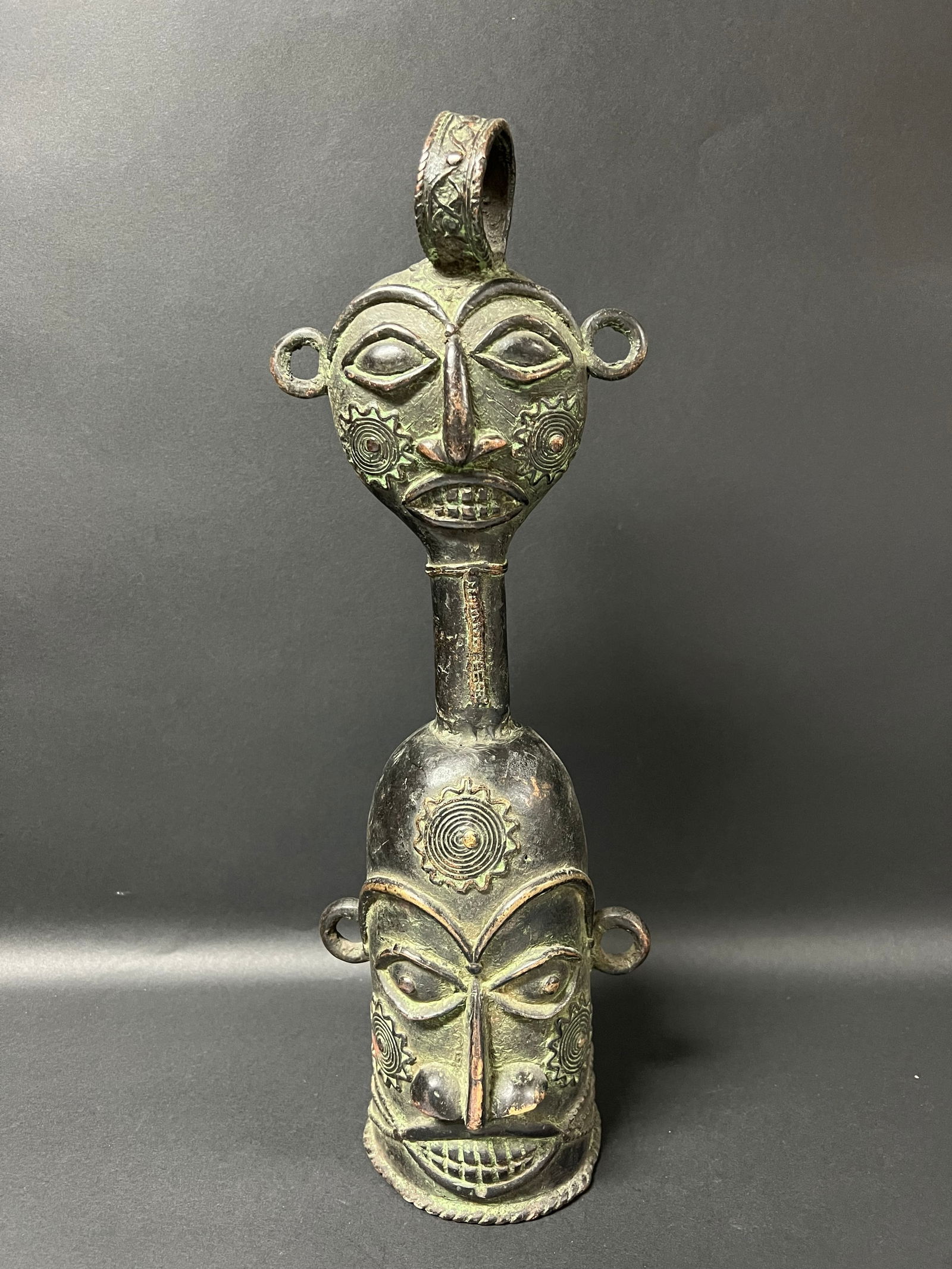 Benin Bronze Bell: African Tribal Art Benin Bronze Bell. The dimension is 18 inches high x 6.75 inches wide. Please be aware that some of the items are vintage, secondhand, old ages, antiques and may have a defects or s