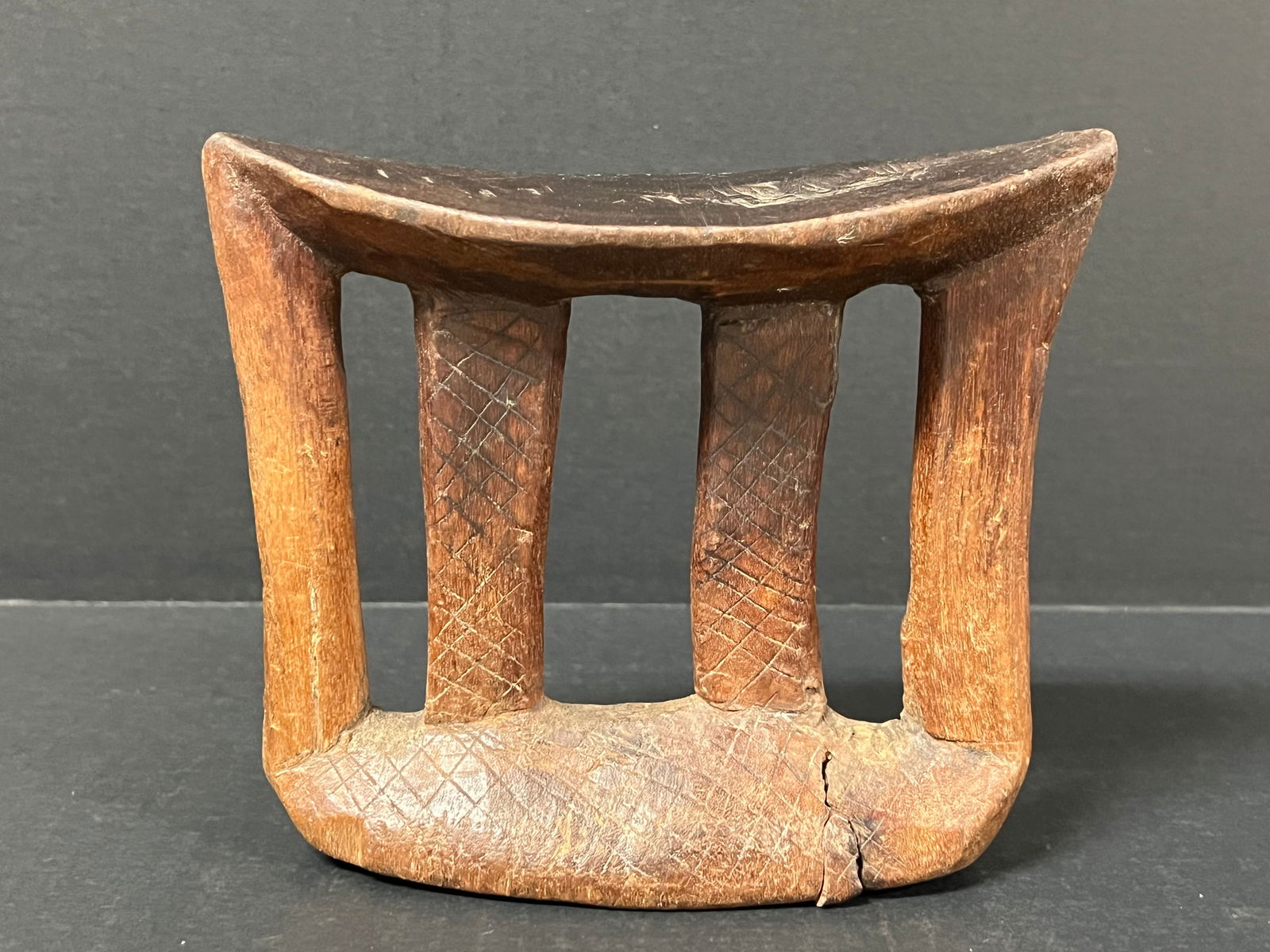 Carved Wood Ethiopian Pillow: African Tribal Art Carved Wood Ethiopian Pillow. The dimension is 6.25 inches high x 7 inches wide. Please be aware that some of the items are vintage, secondhand, old ages, antiques and may have a de