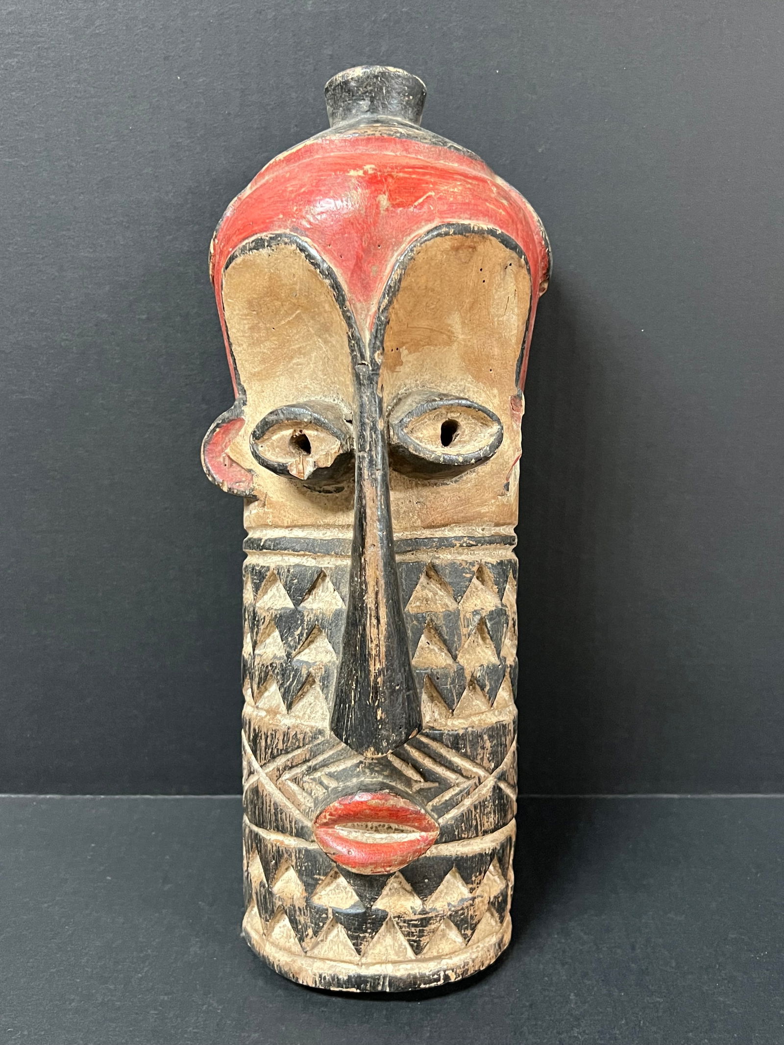Bembe Mask: African Tribal Art Bembe Mask. The dimension is 14 inches high x 4 inches depth x 6 inches wide. Please be aware that some of the items are vintage, secondhand, old ages, antiques and may have a defec