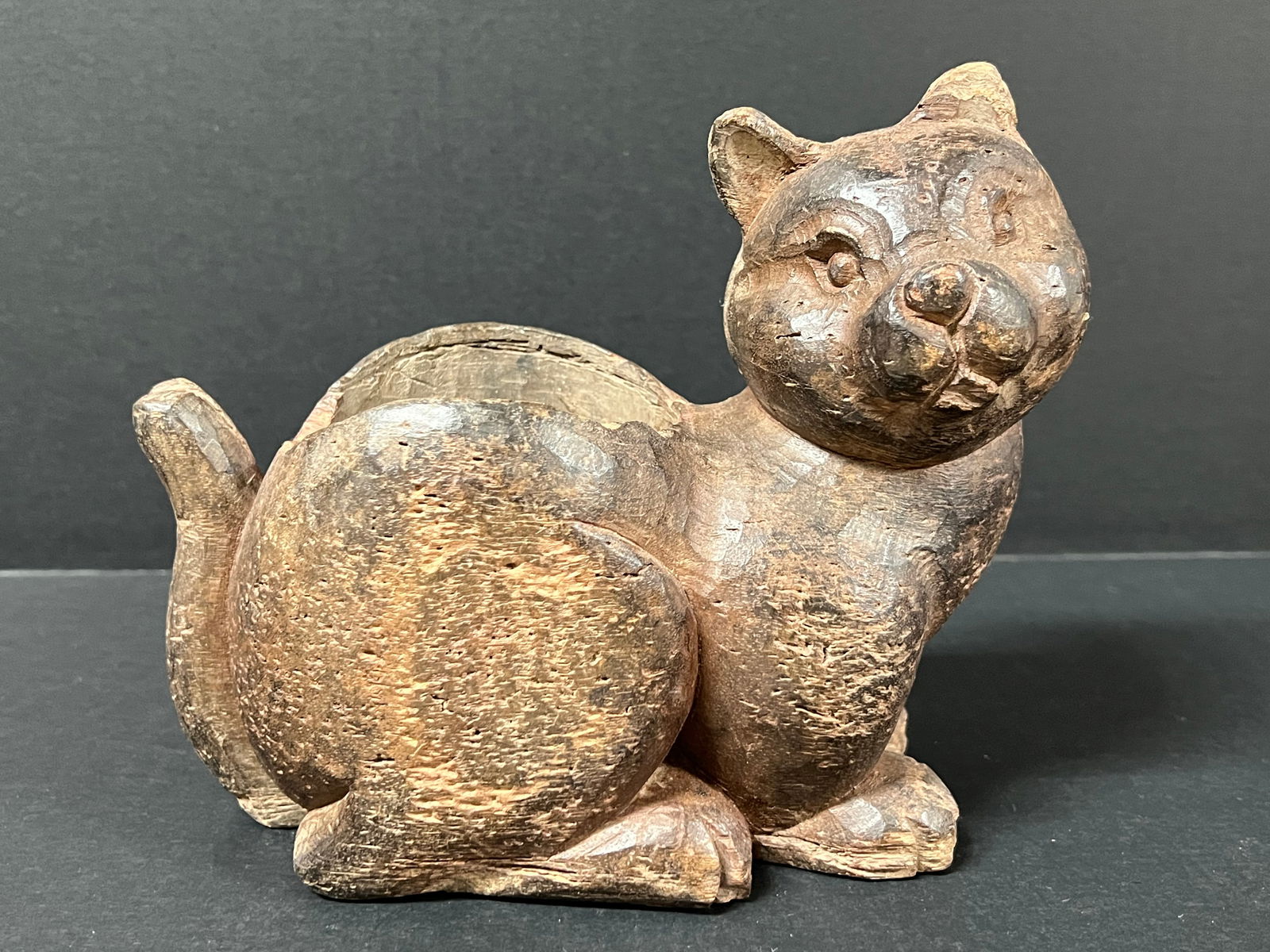 Carved Wood Cat Container: Folk Art Carved Wood Cat Container. The dimension is 7.25 inches high x 4.5 inches depth x 8.5 inches wide. Please be aware that some of the items are vintage, secondhand, old ages, antiques and may h