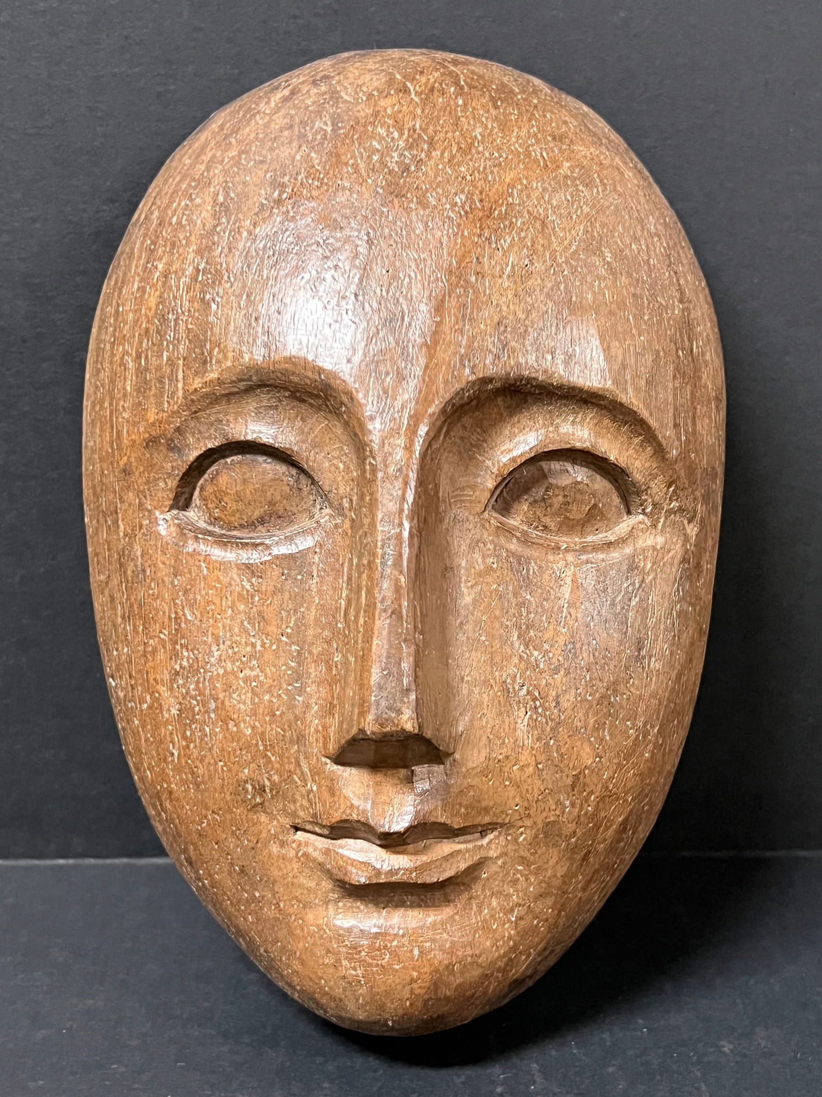 Carved Wood Male Face: Folk Art Carved Wood Male Face. The dimension is 8.5 inches high x 3 inches depth x 5 inches wide. Please be aware that some of the items are vintage, secondhand, old ages, antiques and may have a def