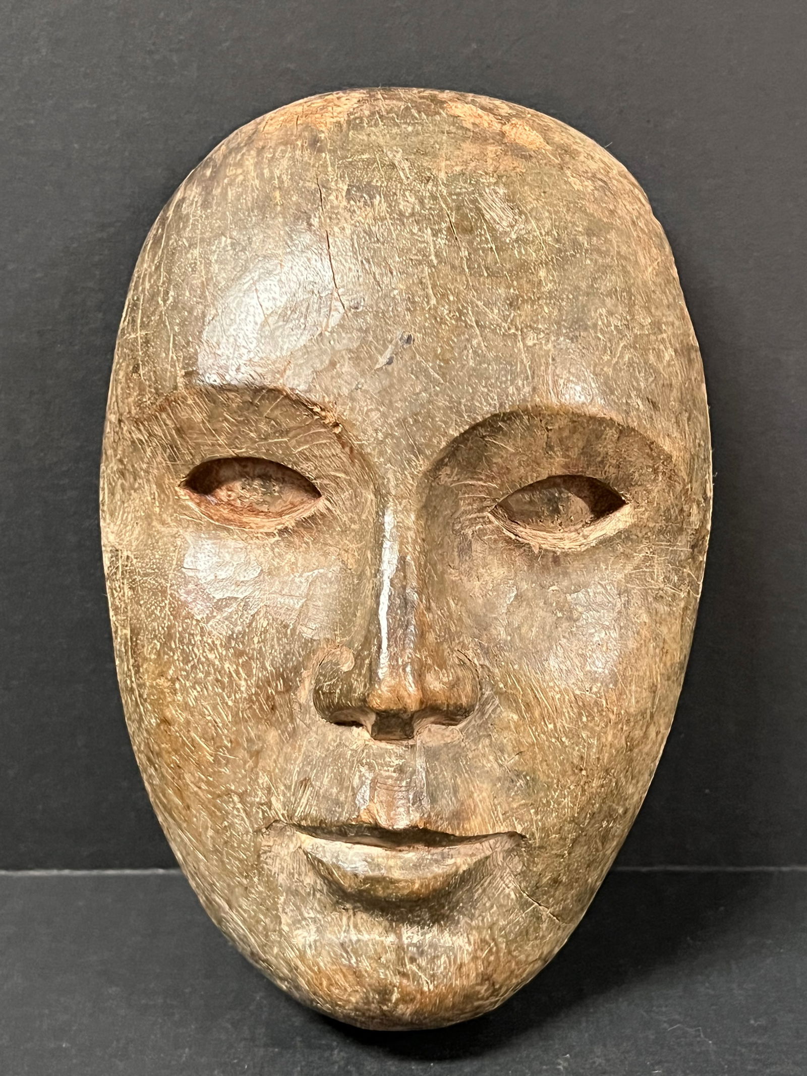 Carved Wood Male Face: Folk Art Carved Wood Male Face. The dimension is 8.5 inches high x 2.5 inches depth x 5.5 inches wide. Please be aware that some of the items are vintage, secondhand, old ages, antiques and may have a