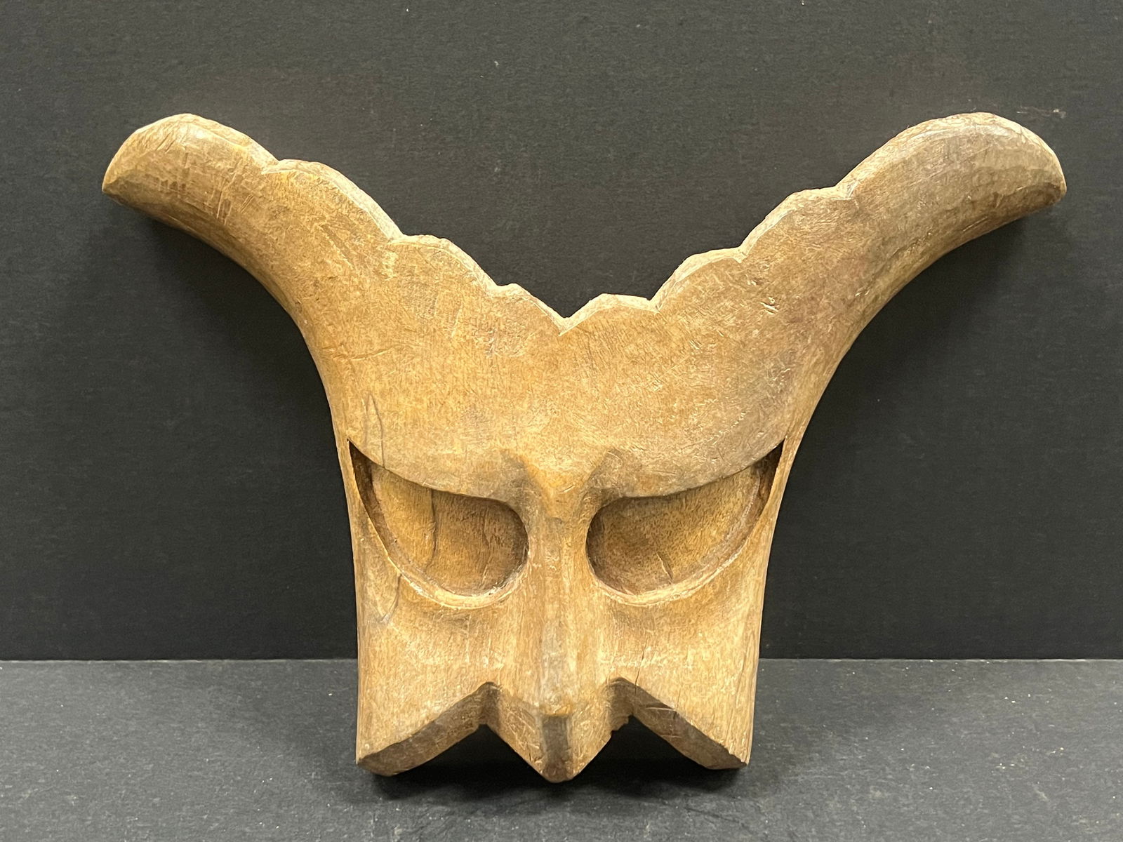 Masquerade Wall Mask Sculpture: Folk Art Carved Wood Masquerade Mask Wall Sculpture. The dimension is 8.5 inches high x 14 inches wide. Please be aware that some of the items are vintage, secondhand, old ages, antiques and may have