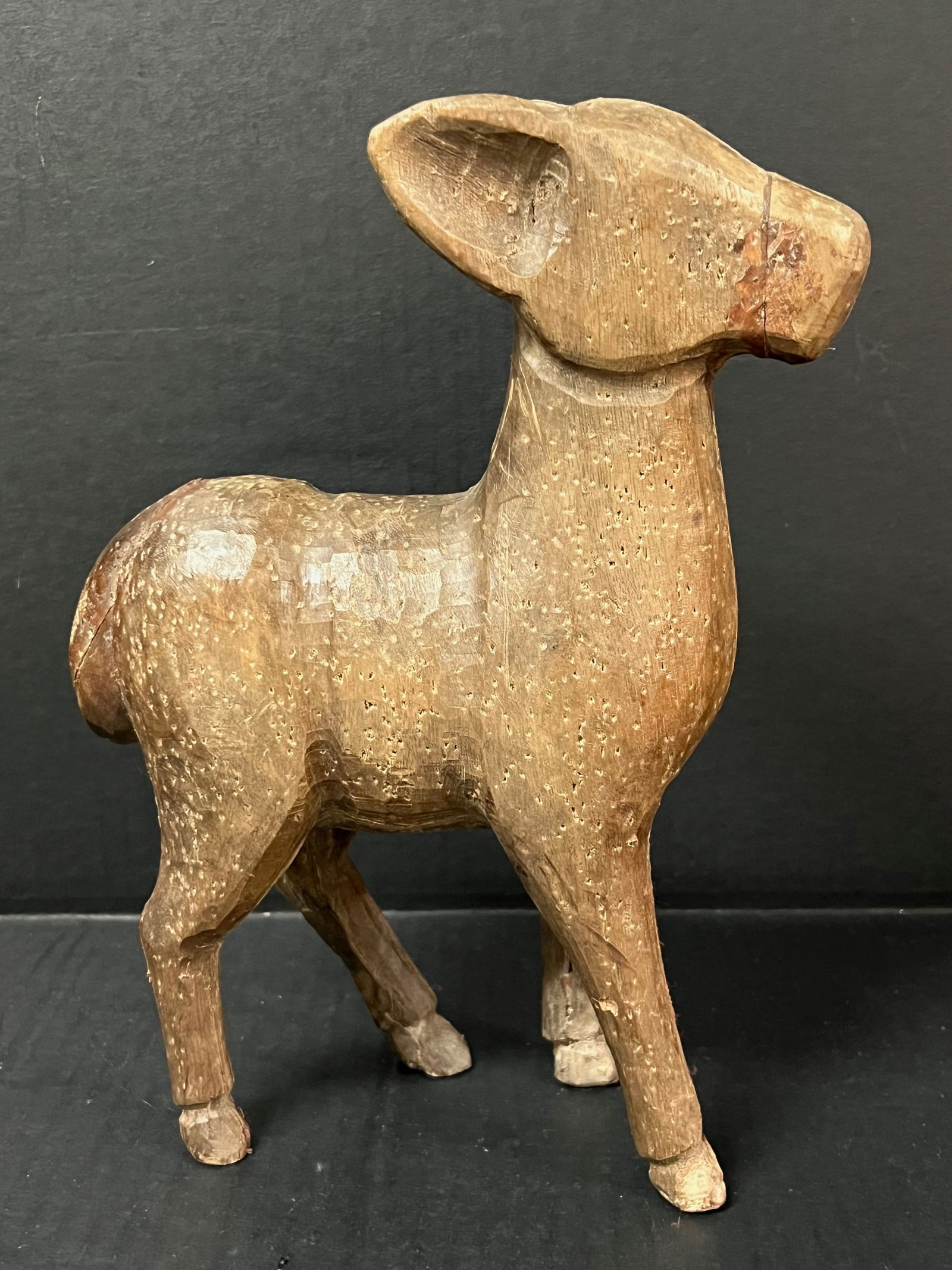 Carved Wood Deer Sculpture: Folk Art Carved Wood Deer Sculpture. The dimension is 13 inches high x 9 inches wide. Please be aware that some of the items are vintage, secondhand, old ages, antiques and may have a defects or sign