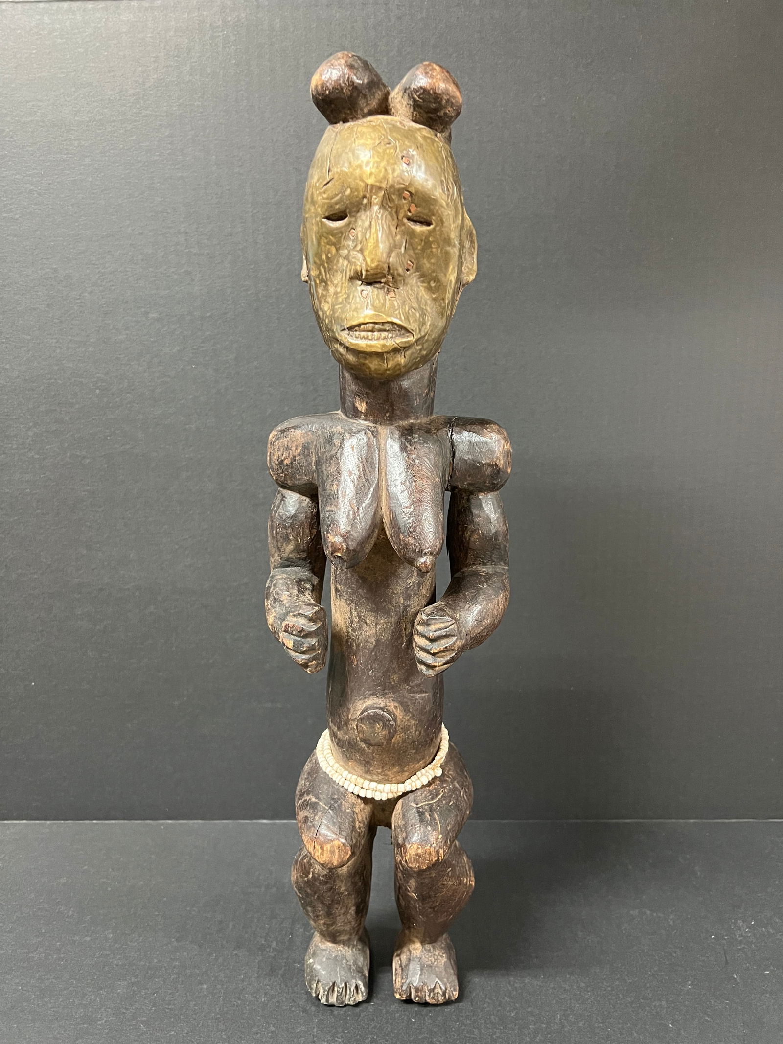 Fang Statue: African Tribal Art Fang Statue. The dimension is 20 inches high x 4.5 inches depth x 5.5 inches wide. Please be aware that some of the items are vintage, secondhand, old ages, antiques and may have a