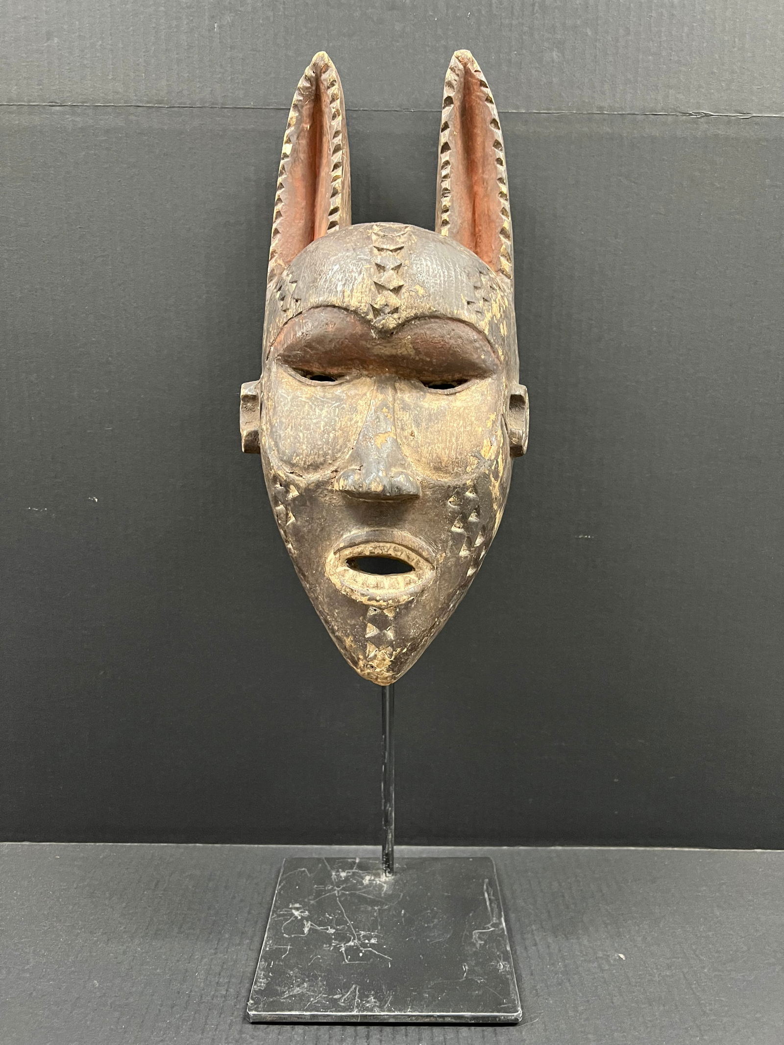 Bamana Mask with Display Stand: African Tribal Art Bamana Mask with display stand. The dimension is 17 inches high x 8 inches wide. Please be aware that some of the items are vintage, secondhand, old ages, antiques and may have a de