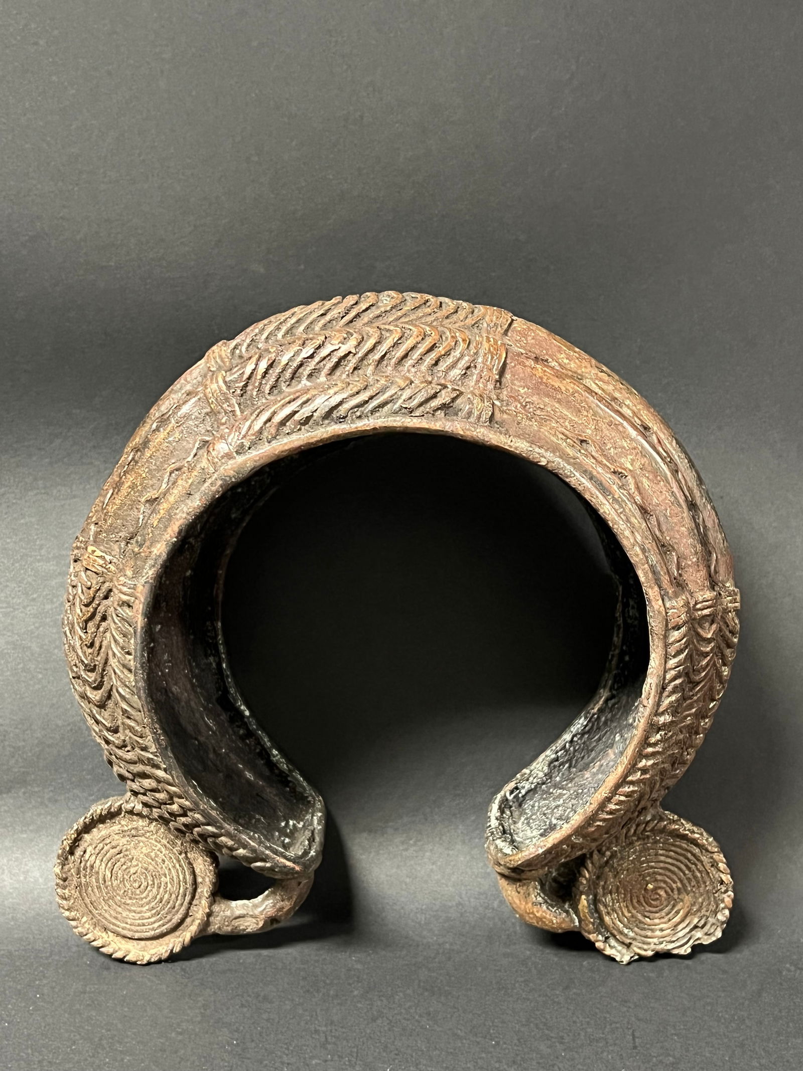 Bronze Nigerian Currency Bracelet: African Tribal Art Bronze Nigerian Currency Bracelet. The dimension is 8 inches high x 4.5 inches depth x 8.5 inches wide. Please be aware that some of the items are vintage, secondhand, old ages,
