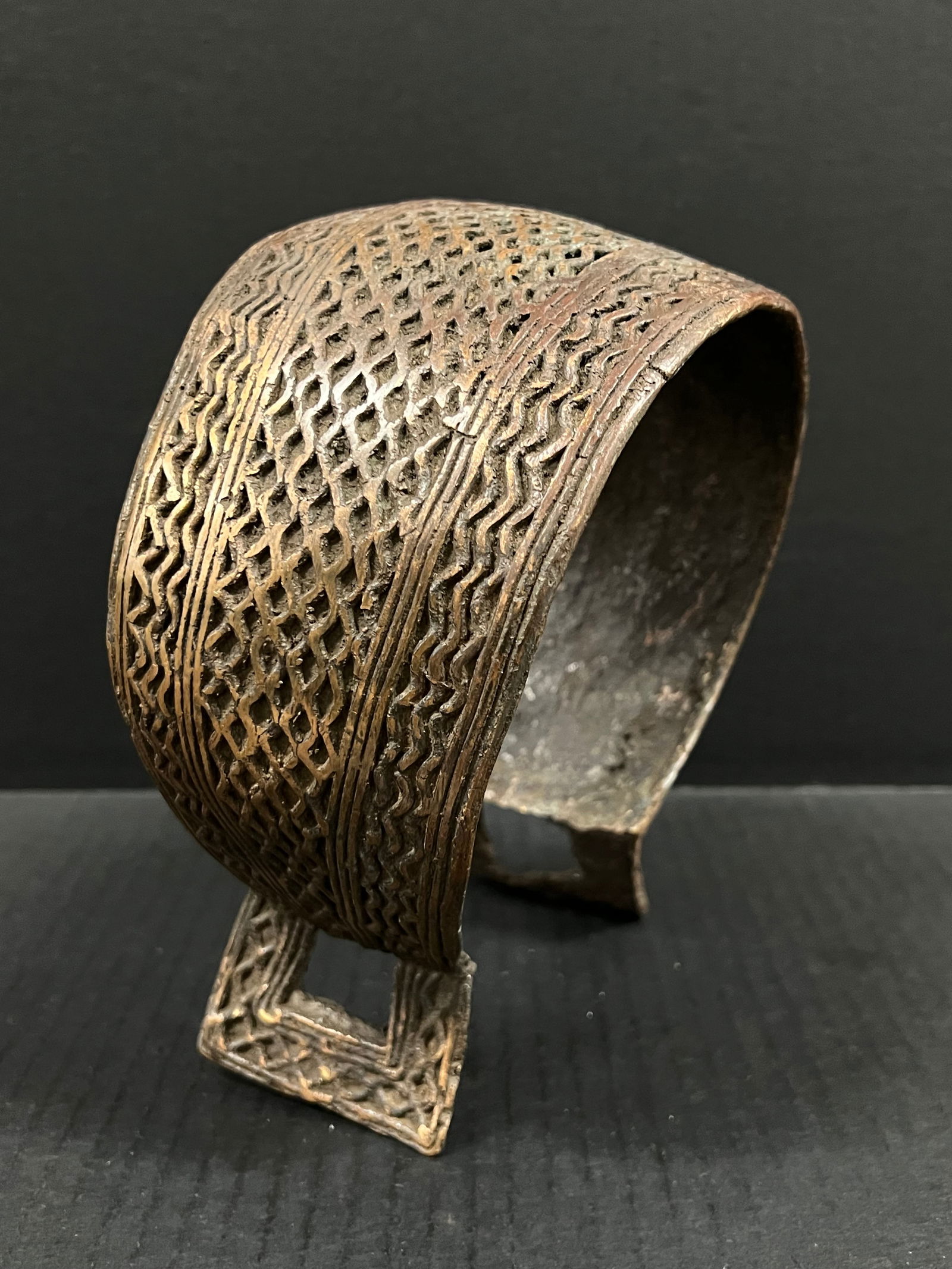 Bronze Nigerian Currency Bracelet: African Tribal Art Bronze Nigerian Currency Bracelet. The dimension is 8 inches high x 4 inches depth x 8 inches wide. Please be aware that some of the items are vintage, secondhand, old ages,