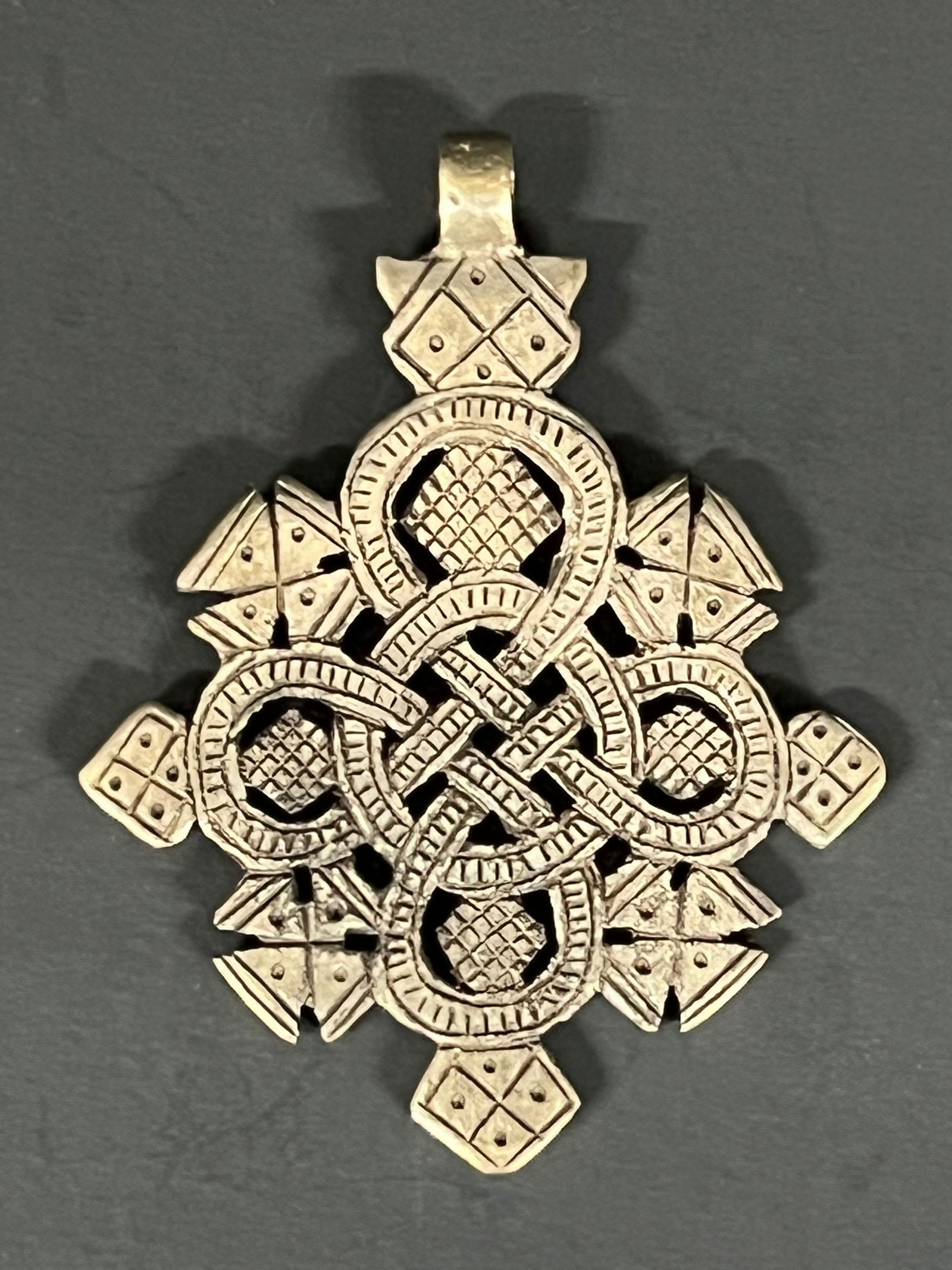 Ethiopian Metal Coptic Cross Pendant: African Tribal Art Ethiopian Metal Coptic Cross Pendant. The dimension is 3.25 inches high x 2.5 inches wide. Please be aware that some of the items are vintage, secondhand, old ages, antiques and