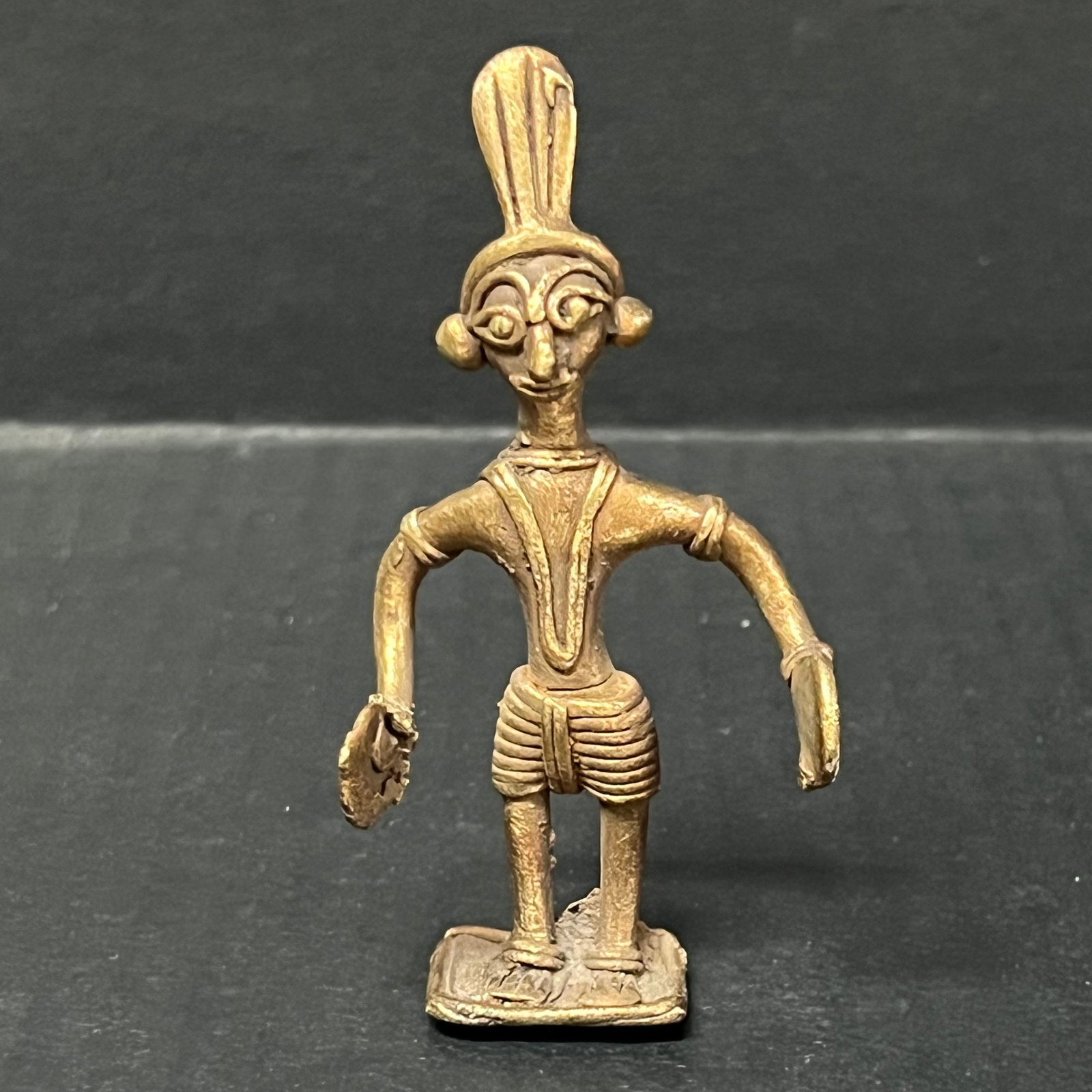 Bronze Akan Statue: African Tribal Art Bronze Akan Statue. The dimension is 3.75 inches high x 2 inches wide. Please be aware that some of the items are vintage, secondhand, old ages, antiques and may have a defects or