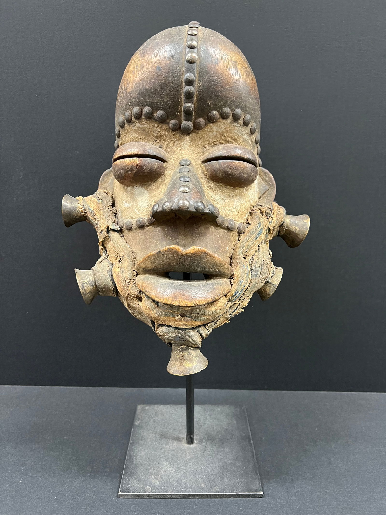 Bete Mask with Stand: African Tribal Art Bete Mask with Stand. The dimension is 13 inches high x 10 inches wide. Please be aware that some of the items are vintage, secondhand, old ages, antiques and may have a defects or