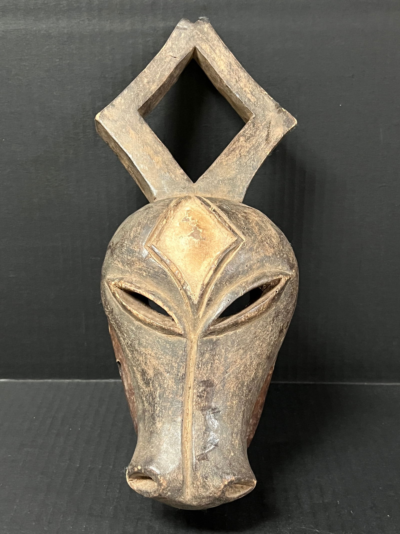 Kwele Mask: African Tribal Art Kwele Mask. The dimension is 13.5 inches high x 8 inches wide. Please be aware that some of the items are vintage, secondhand, old ages, antiques and may have a defects or sign of