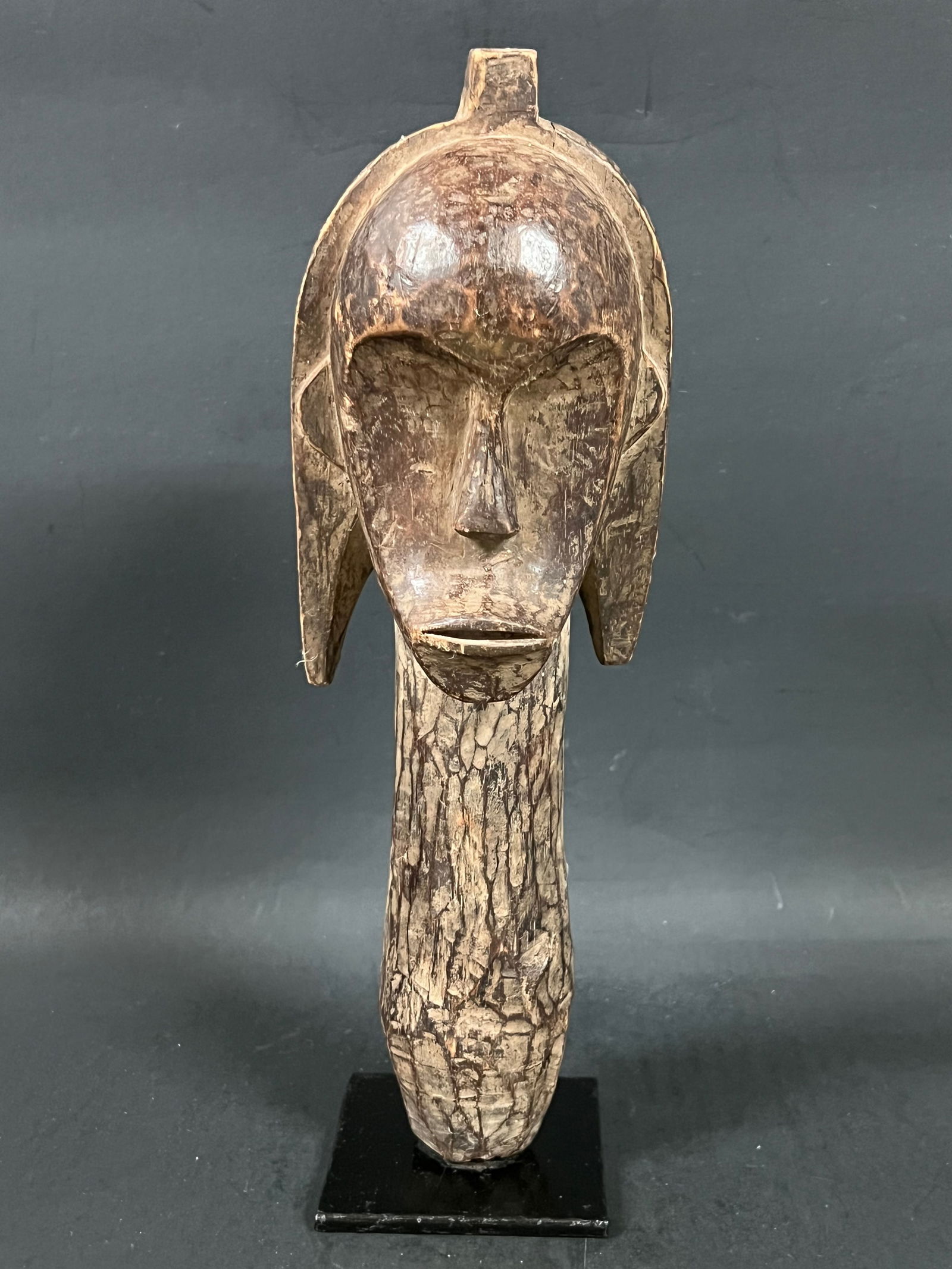 Fang Head: African Tribal Art Fang Head. The dimension is 11.25 inches high x 4 inches wide. Please be aware that some of the items are vintage, secondhand, old ages, antiques and may have a defects or sign of