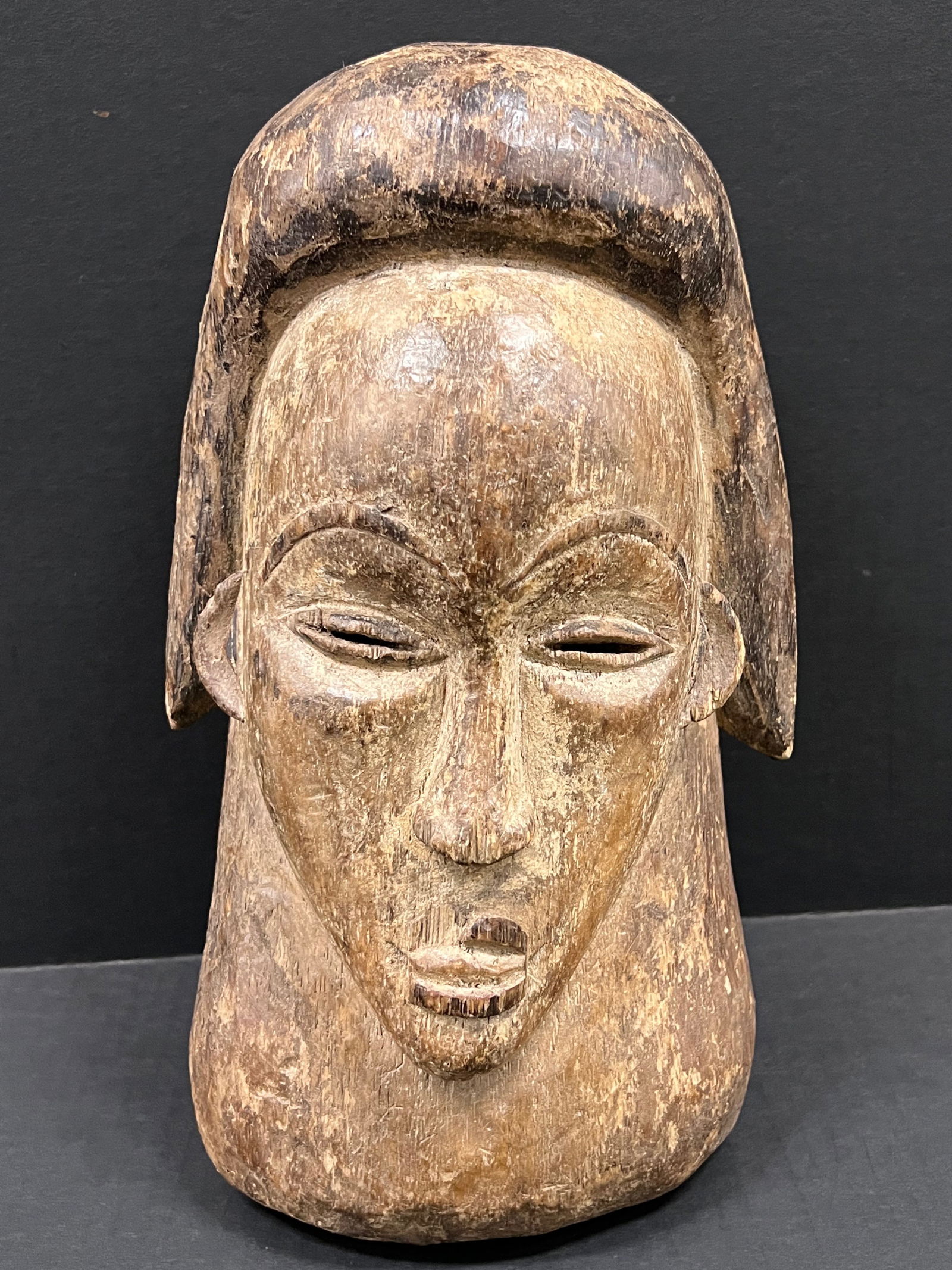 Lumbo Mask: African Tribal Art Lumbo Mask. The dimension is 13.5 inches high x 8 inches wide. Please be aware that some of the items are vintage, secondhand, old ages, antiques and may have a defects or sign of a