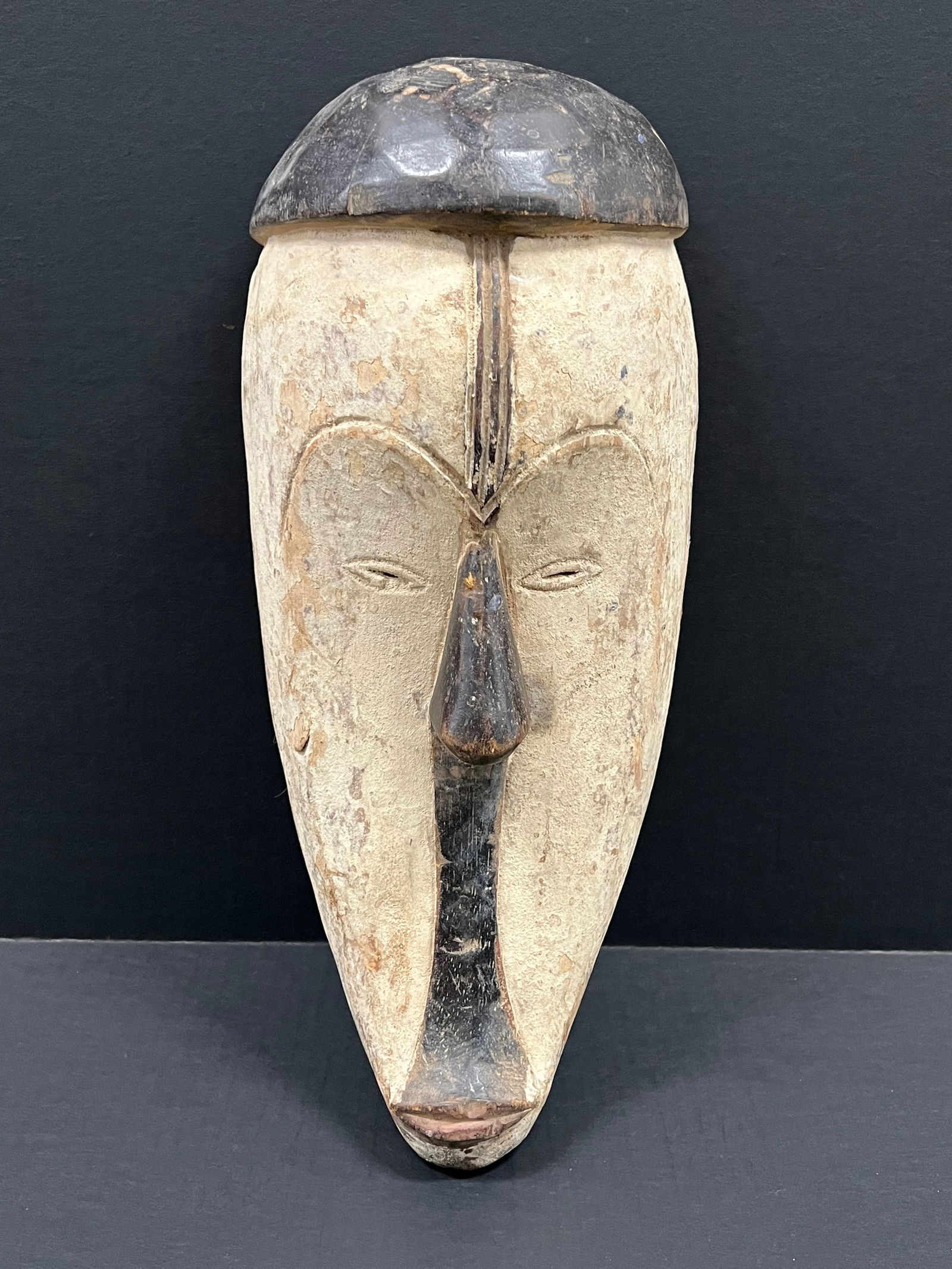 Fang Mask: African Tribal Art Fang Mask. The dimension is 17.5 inches high x 8 inches wide. Please be aware that some of the items are vintage, secondhand, old ages, antiques and may have a defects or sign of