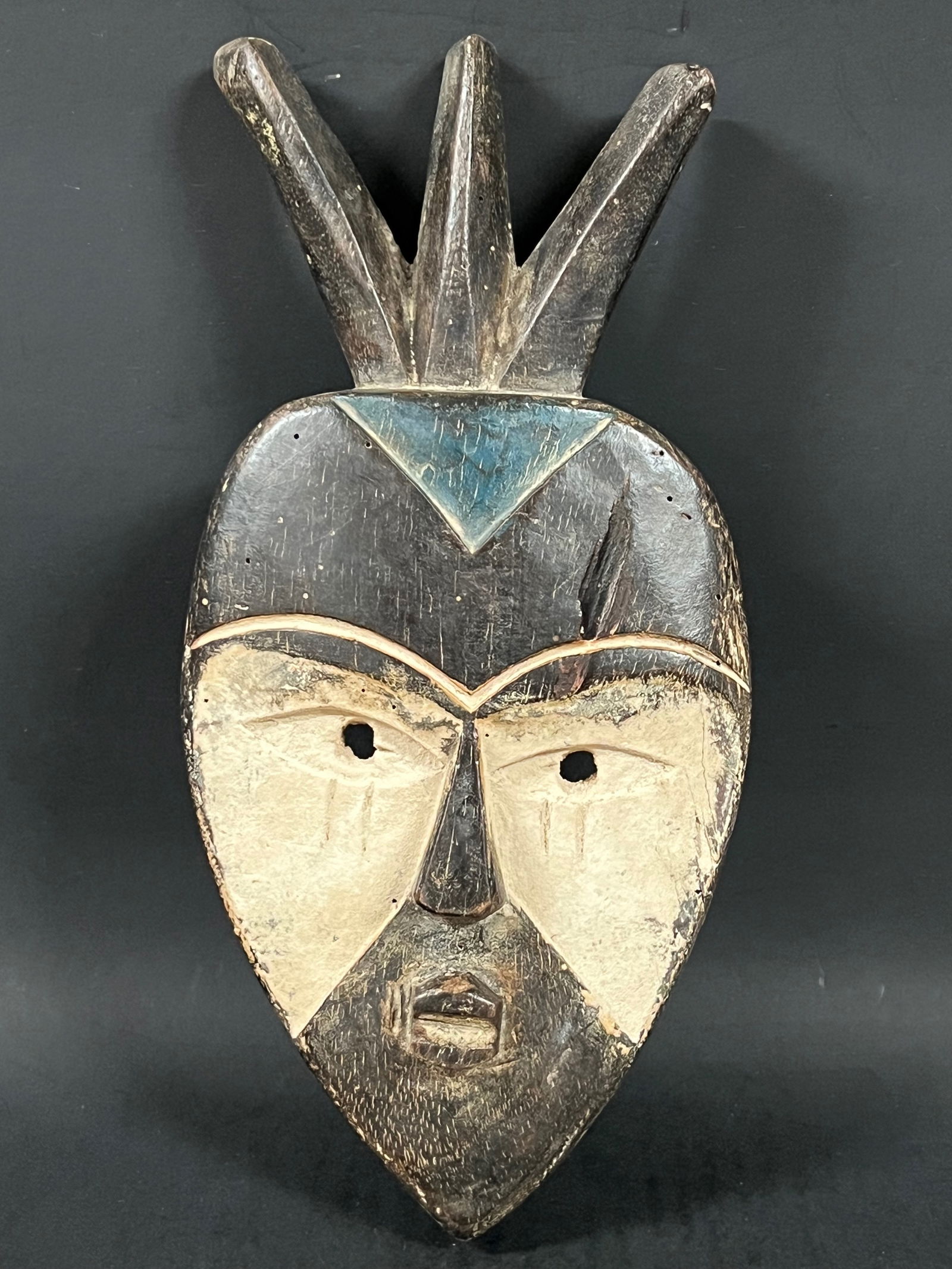Vuvi Mask: African Tribal Art Vuvi Mask. The dimension is 12 inches high x 6 inches wide. Please be aware that some of the items are vintage, secondhand, old ages, antiques and may have a defects or sign of ages