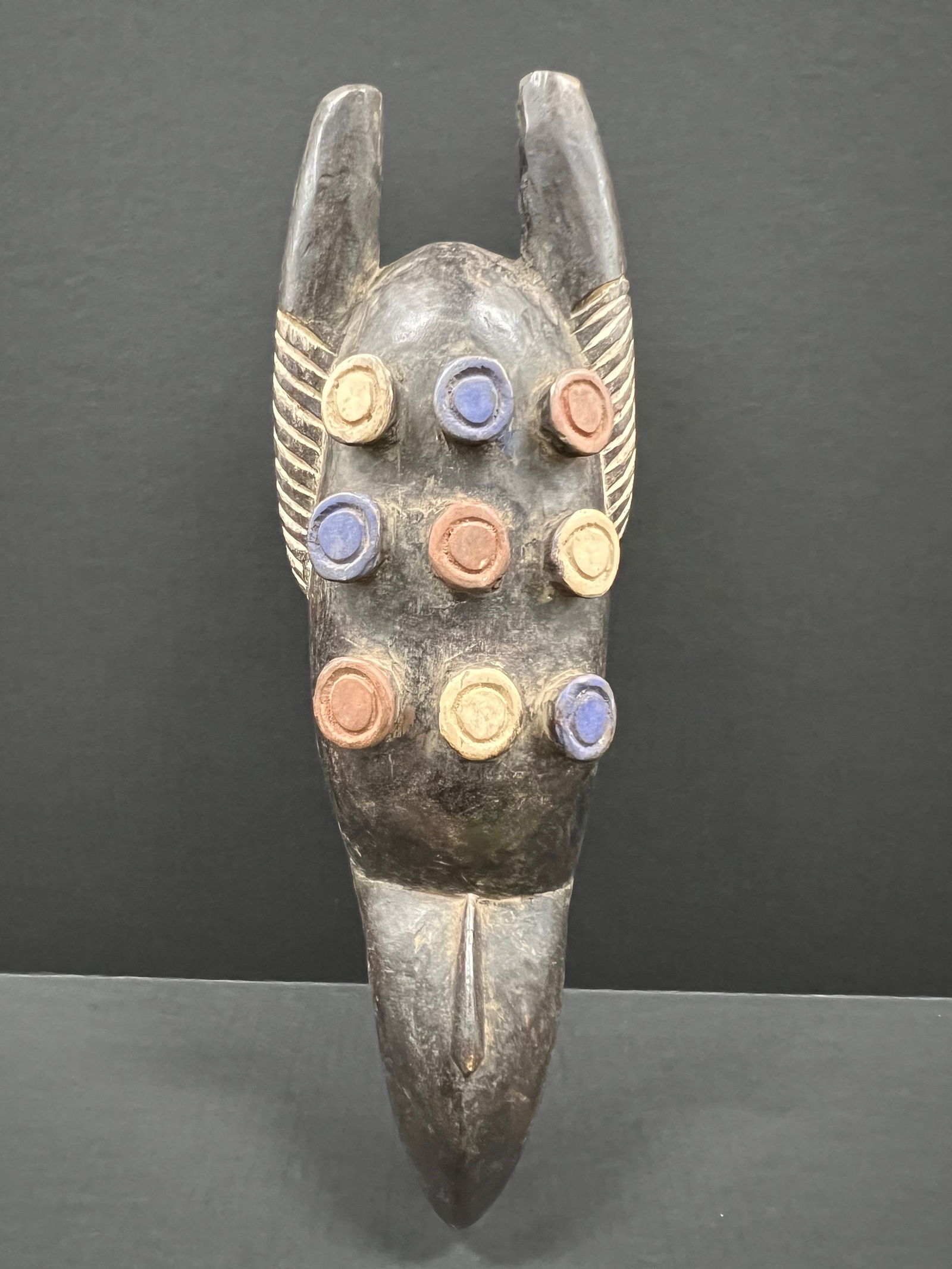 Grebo Mask: African Tribal Art Grebo Mask. The dimension is 19 inches high x 6.5 inches wide. Please be aware that some of the items are vintage, secondhand, old ages, antiques and may have a defects or sign of a