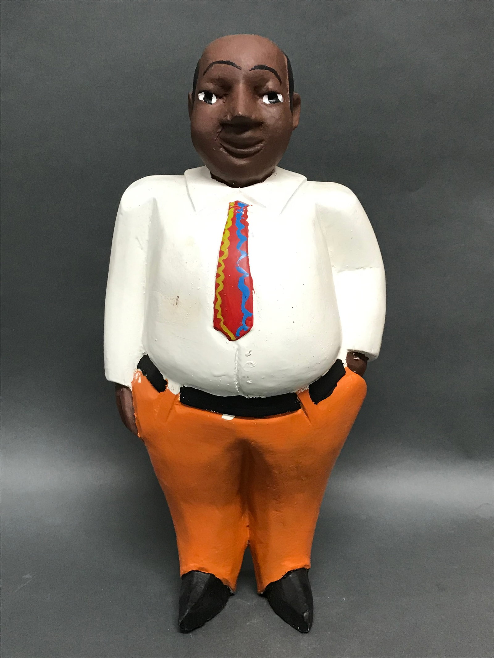 Colonial Male Statue: African Tribal Art Colonial Male Statue .The dimension is 13 inches high x 7.5 inches wide. Please be aware that some of the items are vintage, secondhand, old ages, antiques and may have a defects