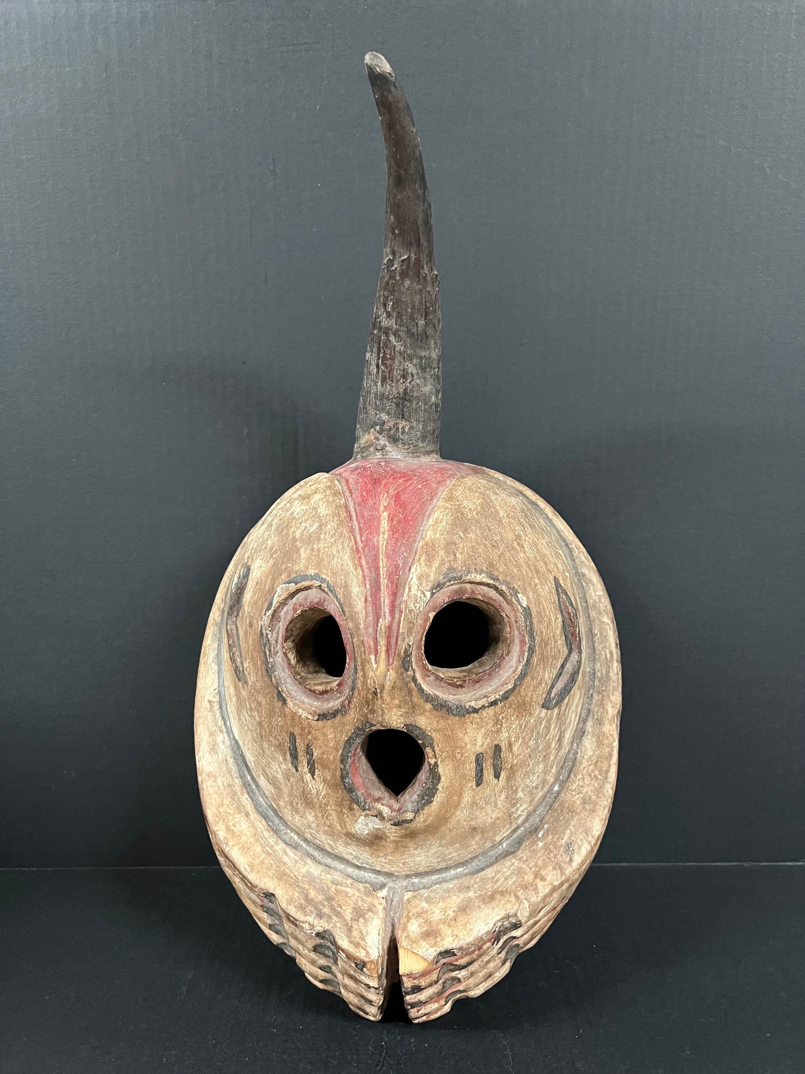Skull Mask: African Tribal Art Skull Mask. The dimension is 19 inches high x 11 inches wide. Please be aware that some of the items are vintage, secondhand, old ages, antiques and may have a defects or sign of ag