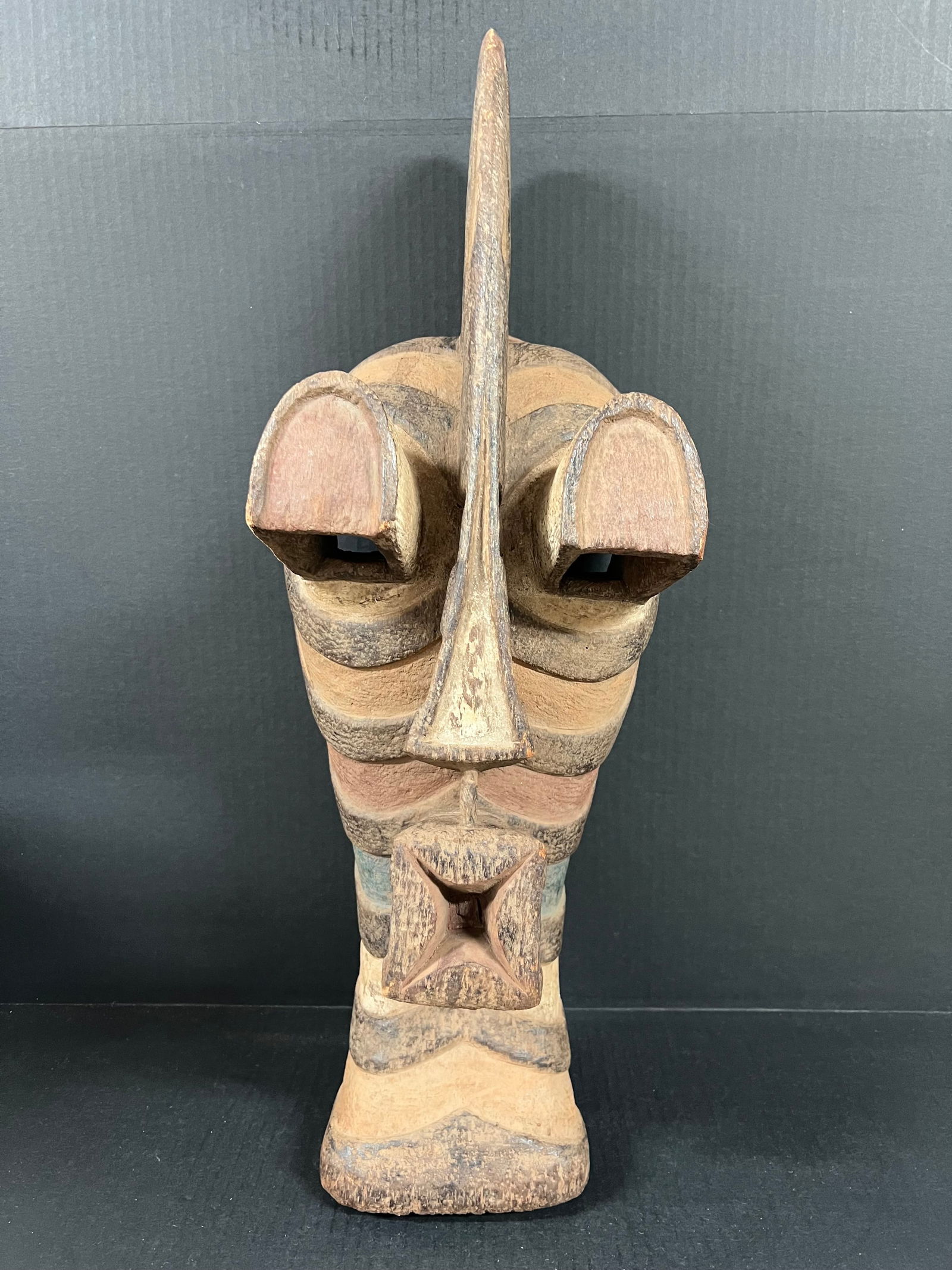 Large Songye Mask: African Tribal Art Songye Mask. The dimension is 24 inches high x 9 inches wide. Please be aware that some of the items are vintage, secondhand, old ages, antiques and may have a defects or sign of
