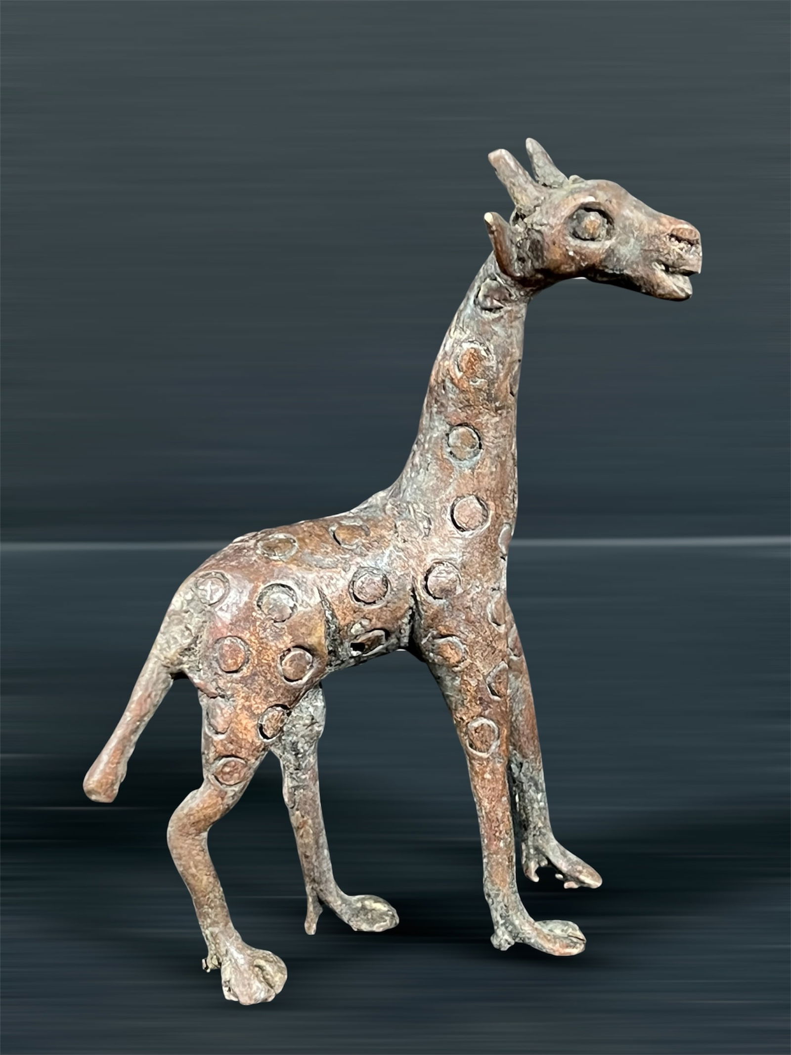 Bronze Giraffe Sculpture: African Tribal Art Bronze Giraffe Sculpture. The dimension is 5 inches high x 3.5 inches wide. Please be aware that some of the items are vintage, secondhand, old ages, antiques and may have a