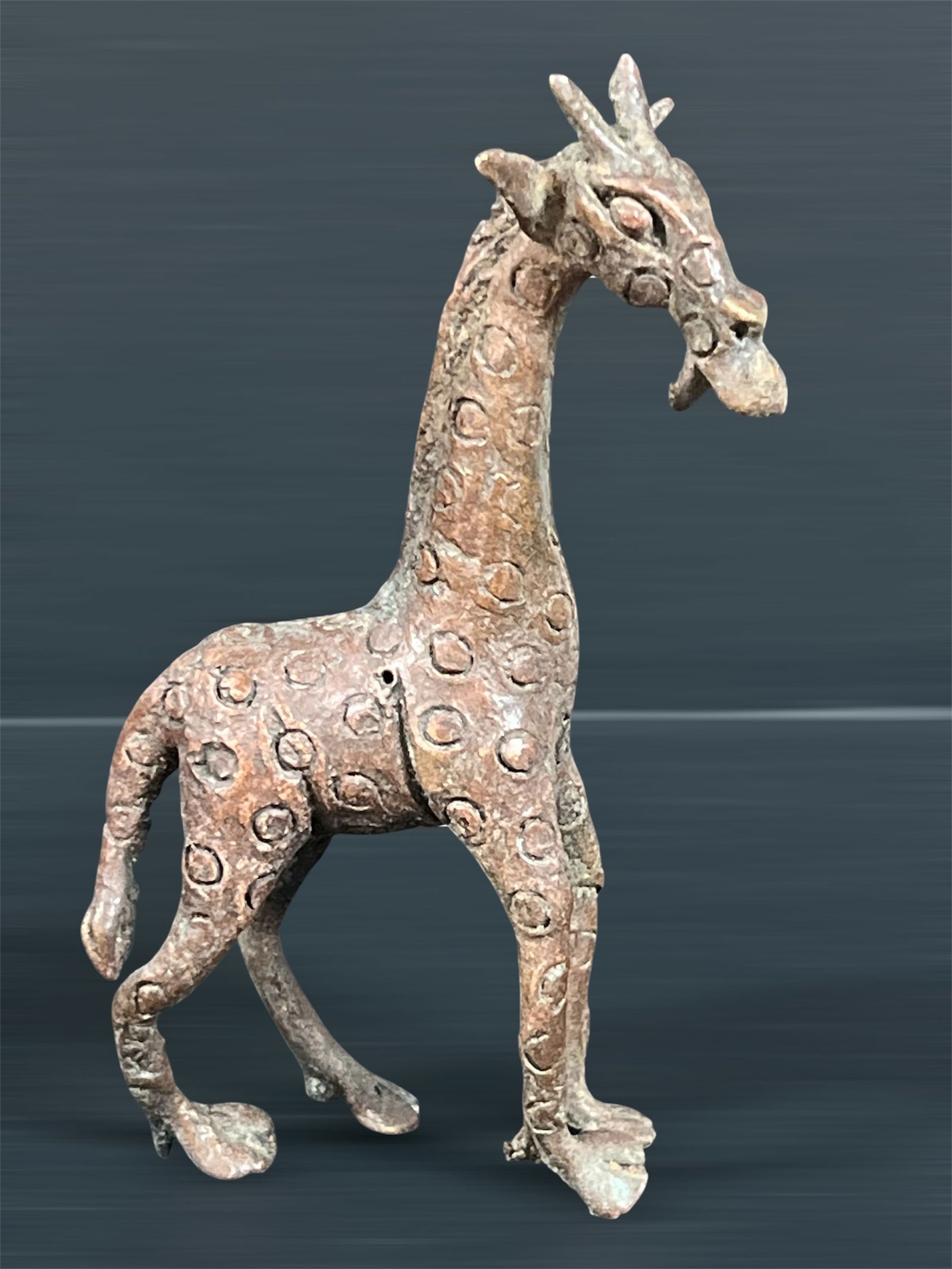 Bronze Giraffe Sculpture: African Tribal Art Bronze Giraffe Sculpture. The dimension is 6.5 inches high x 3.5 inches wide. Please be aware that some of the items are vintage, secondhand, old ages, antiques and may have a