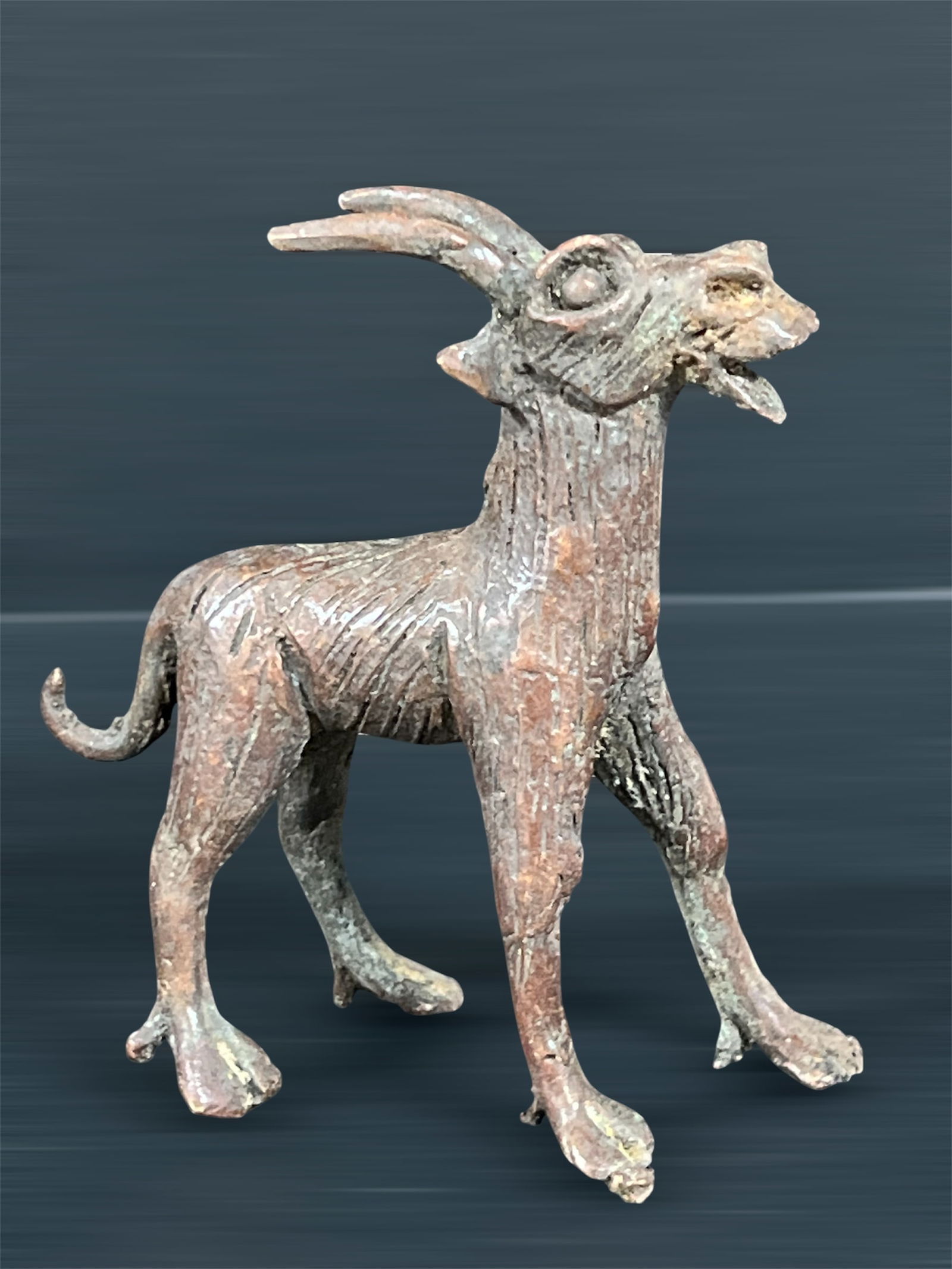 Bronze Goat Sculpture: African Tribal Art Bronze Goat Sculpture. The dimension is 4.5 inches high x 4 inches wide. Please be aware that some of the items are vintage, secondhand, old ages, antiques and may have a defects