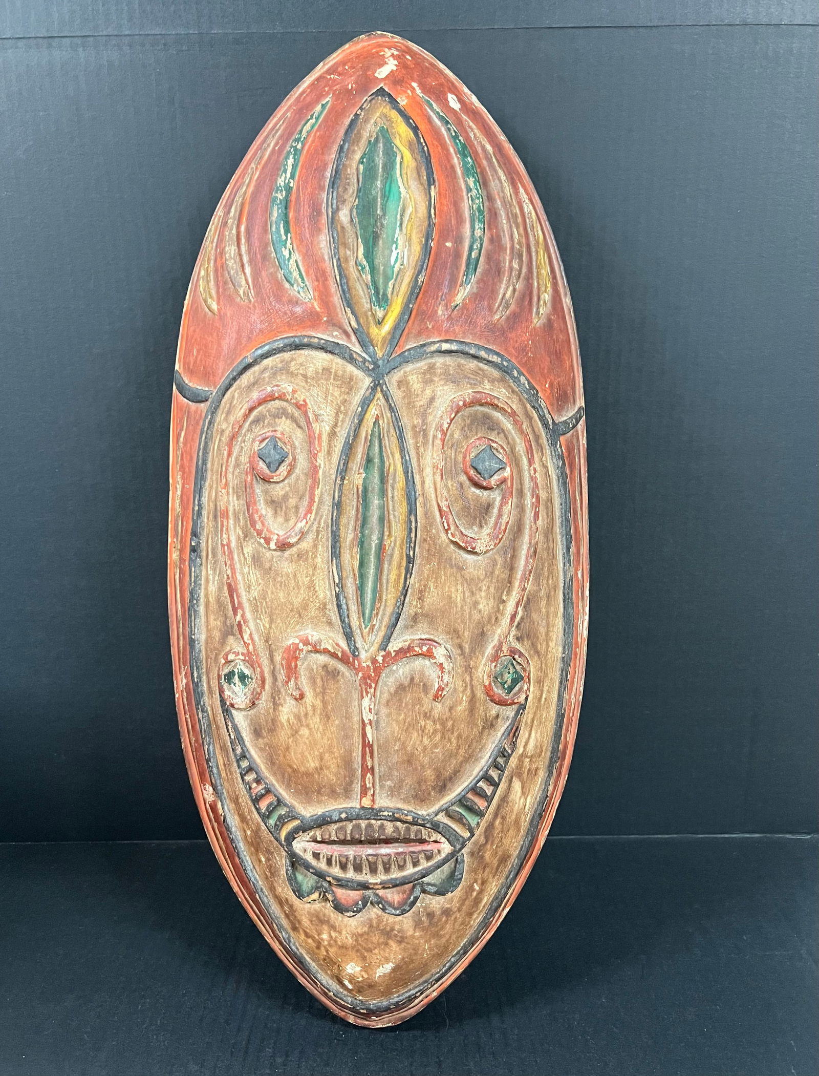 Papua Guinea Shield: African Tribal Art Papua Guinea Shield. The dimension is 24.5 inches high x 5 inches depth x 11 inches wide. Please be aware that some of the items are vintage, secondhand, old ages, antiques and may