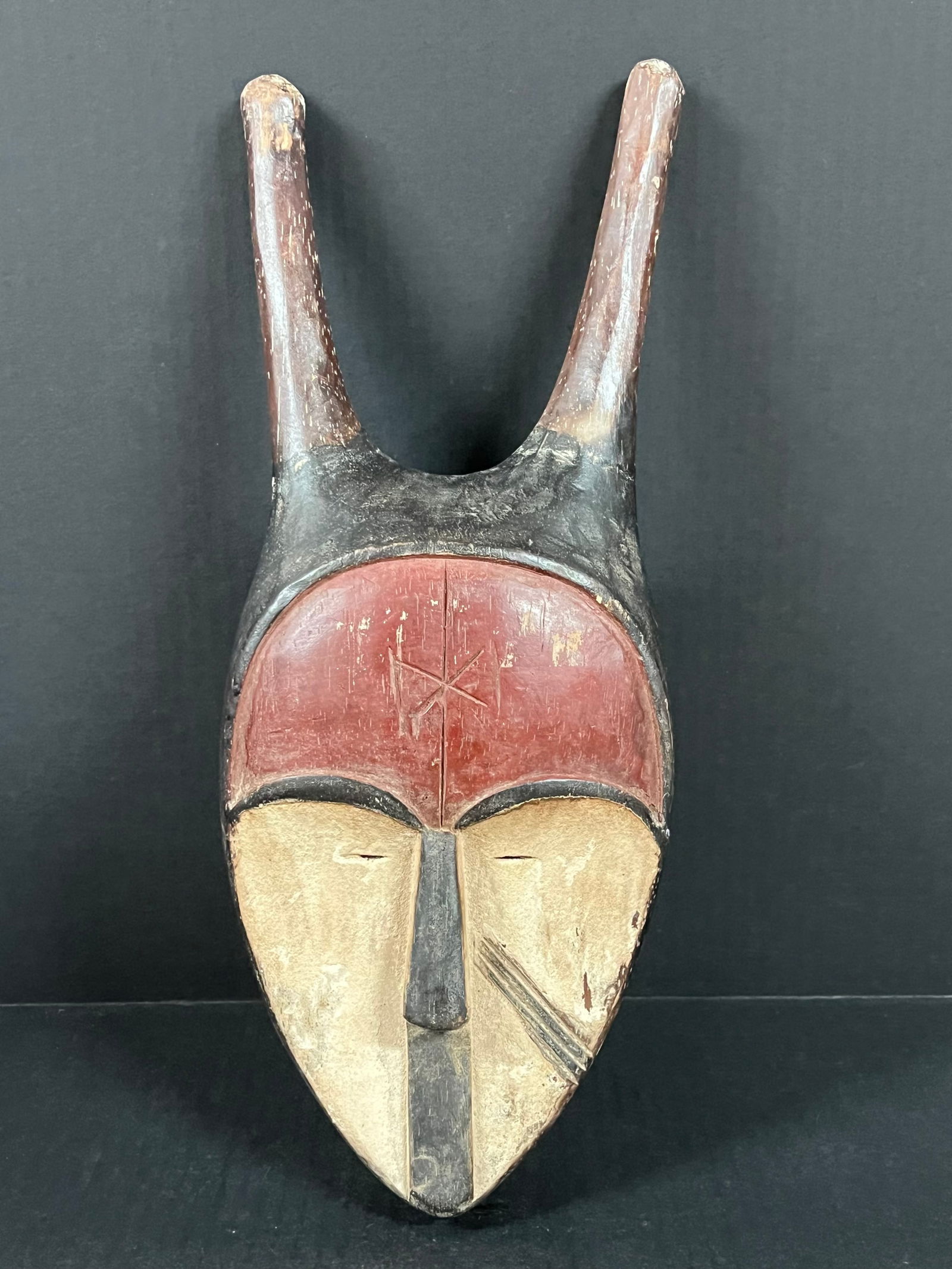 Vuvi Mask: African Tribal Art Vuvi Mask. The dimension is 16.5 inches high x 6.5 inches wide. Please be aware that some of the items are vintage, secondhand, old ages, antiques and may have a defects or sign of