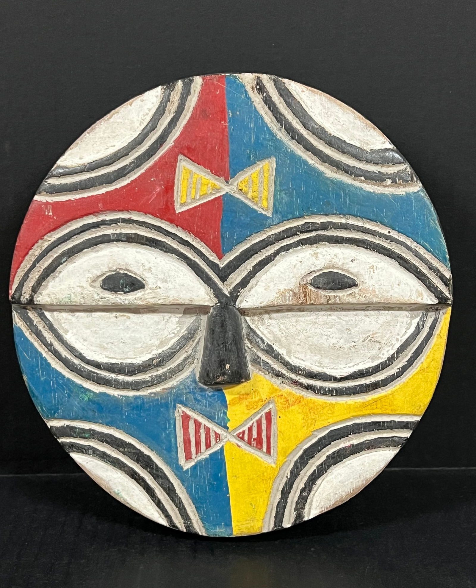 Teke Mask: African Tribal Art Teke Mask. The dimension is 8.25 inches high x 8.25 inches wide. Please be aware that some of the items are vintage, secondhand, old ages, antiques and may have a defects or sign