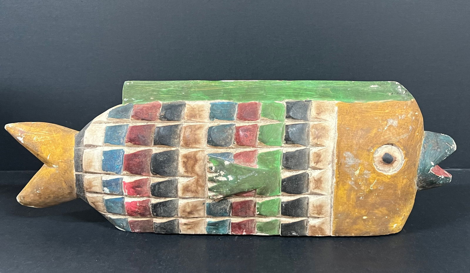 Bozo Puppet Fish: African Tribal Art Bozo Puppet Fish. The dimension is 7 inches high x 19.5 inches long. Please be aware that some of the items are vintage, secondhand, old ages, antiques and may have a defects or