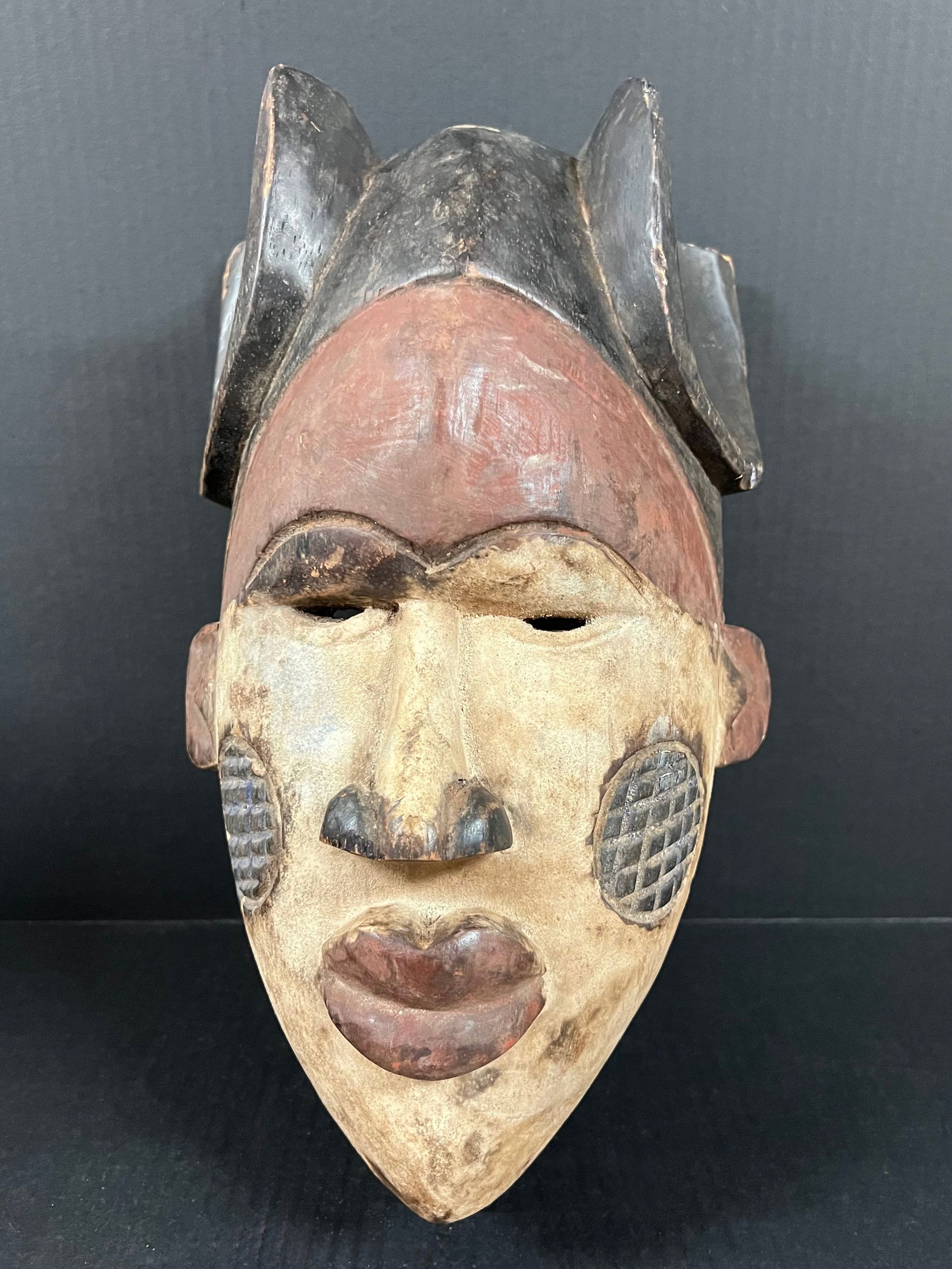 Ibo Mask: African Tribal Art Ibo Mask. The dimension is 15.25 inches high x 7 inches depth x 9 inches wide. Please be aware that some of the items are vintage, secondhand, old ages, antiques and may have a defe