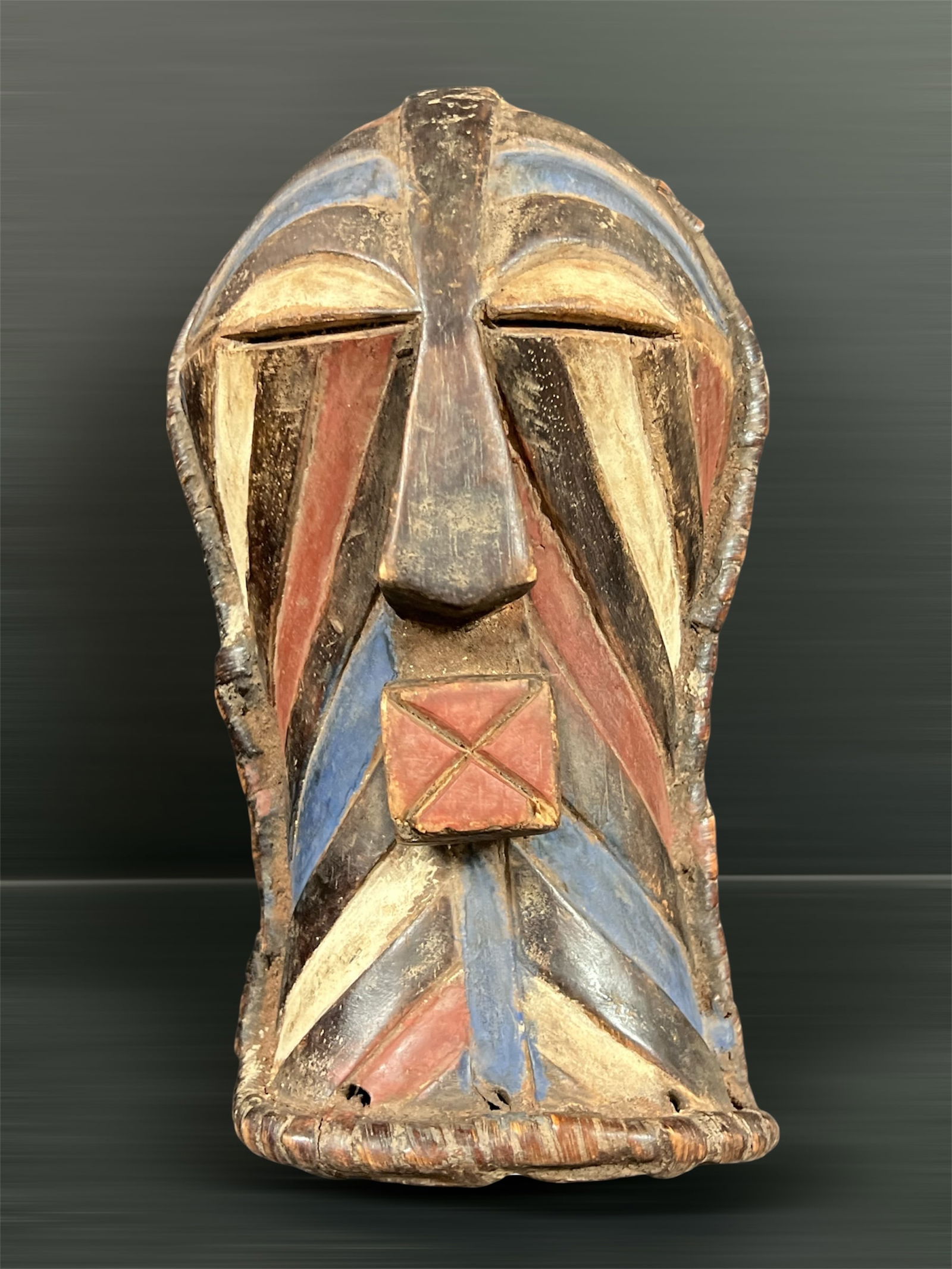 Songye Mask: African Tribal Art Songye Mask. The dimension is 11 inches high x 7 inches wide. Please be aware that some of the items are vintage, secondhand, old ages, antiques and may have a defects or sign of