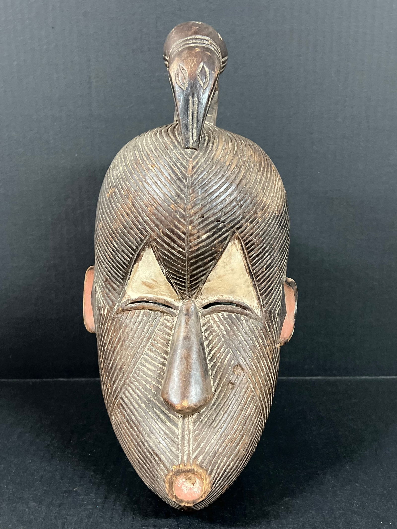 Songye Mask: African Tribal Art Songye Mask. The dimension is 14 inches high x 7 inches wide. Please be aware that some of the items are vintage, secondhand, old ages, antiques and may have a defects or sign of ag