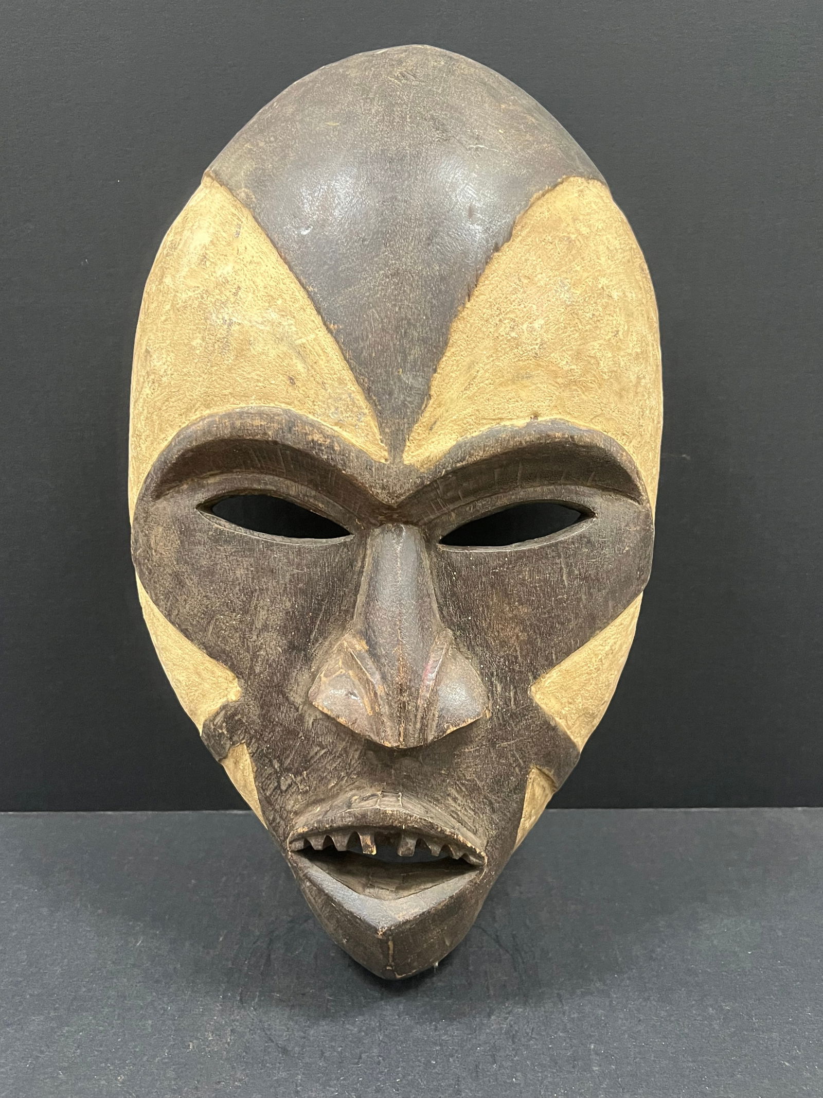 Large Bacongo Mask: African Tribal Art Bacongo Mask. The dimension is 17.5 inches high x 10.5 inches wide. Please be aware that some of the items are vintage, secondhand, old ages, antiques and may have a defects or sign