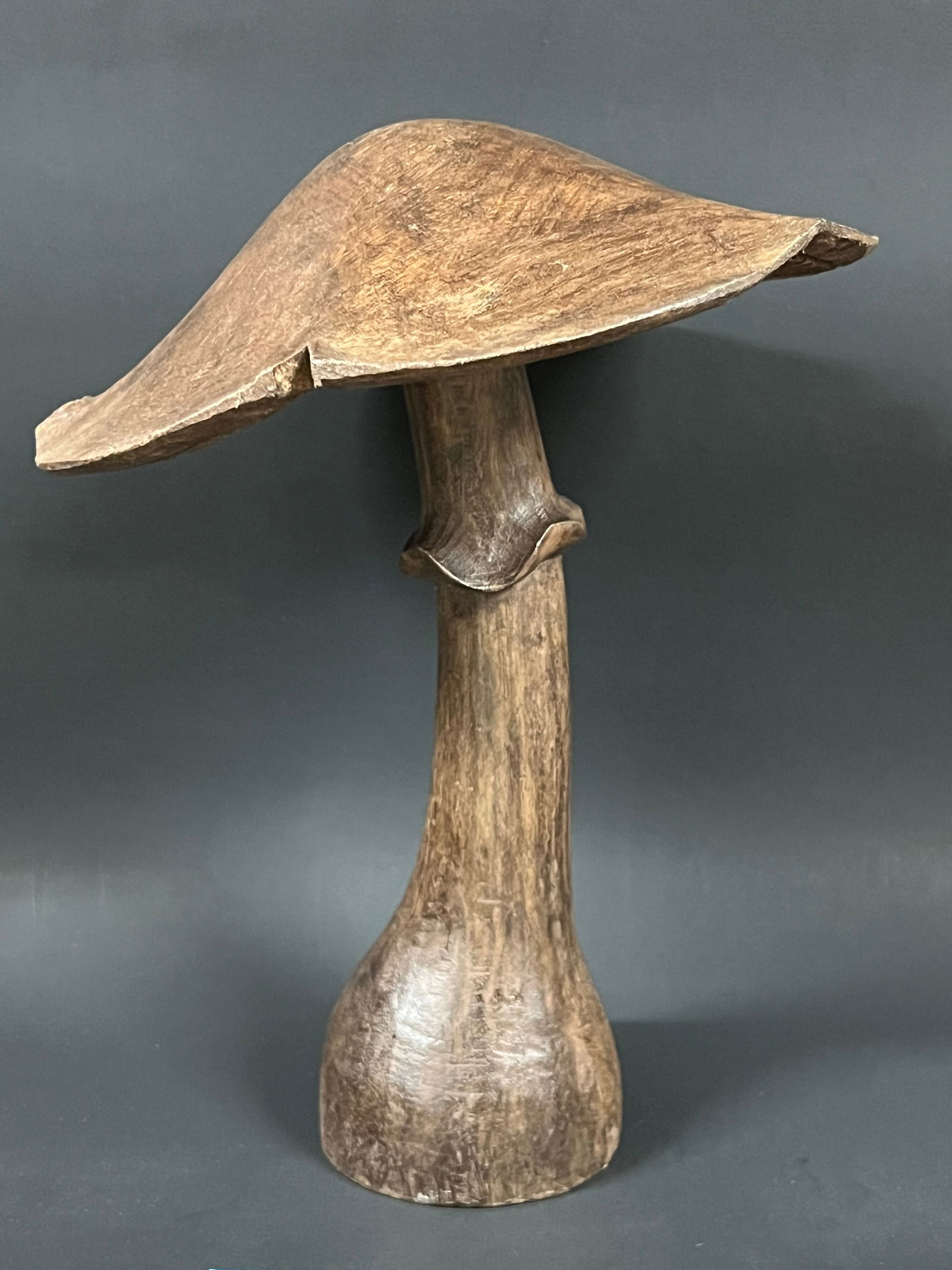 Carved Wood Mushroom: Folk Art Carved Wood Mushroom. The dimension is 10 inches high x 8 inches wide. Please be aware that some of the items are vintage, secondhand, old ages, antiques and may have a defects or sign of