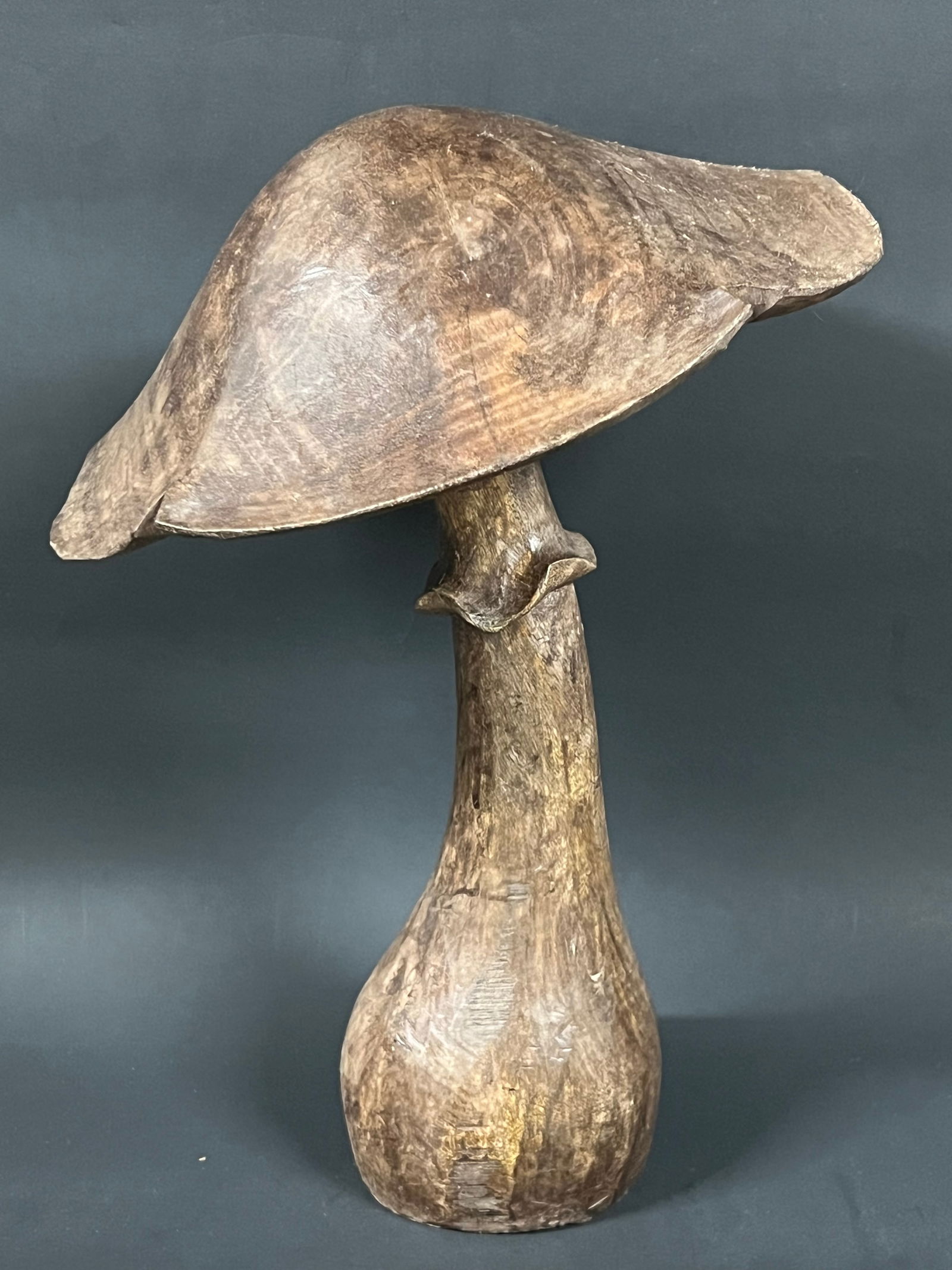 Carved Wood Mushroom: Folk Art Carved Wood Mushroom. The dimension is 12 inches high x 9 inches wide. Please be aware that some of the items are vintage, secondhand, old ages, antiques and may have a defects or sign of