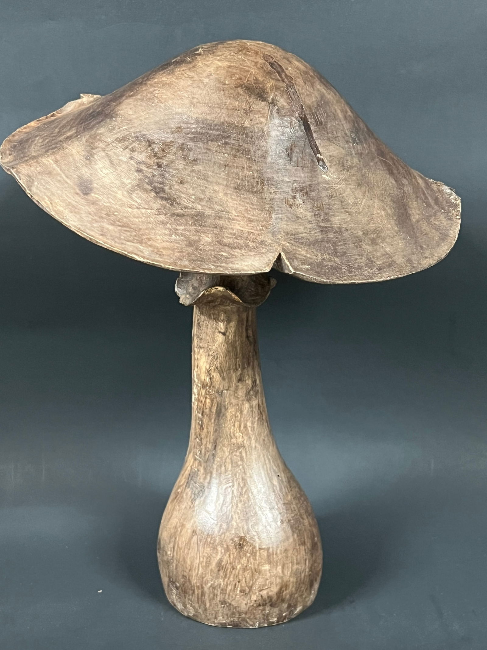 Carved Wood Mushroom: Folk Art Carved Wood Mushroom. The dimension is 12 inches high x 9 inches wide. Please be aware that some of the items are vintage, secondhand, old ages, antiques and may have a defects or sign of