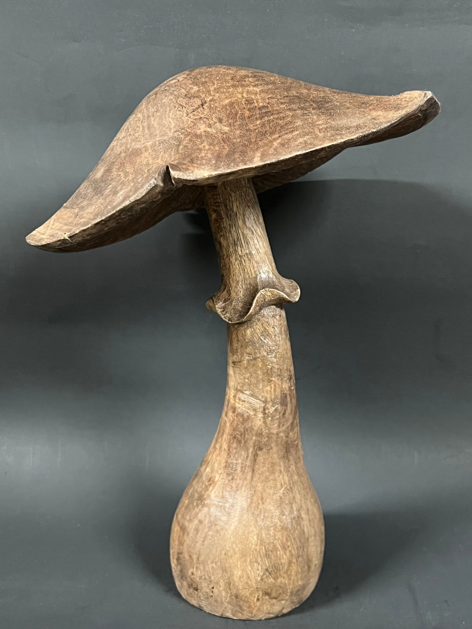 Carved Wood Mushroom: Folk Art Carved Wood Mushroom. The dimension is 12 inches high x 9 inches wide. Please be aware that some of the items are vintage, secondhand, old ages, antiques and may have a defects or sign of