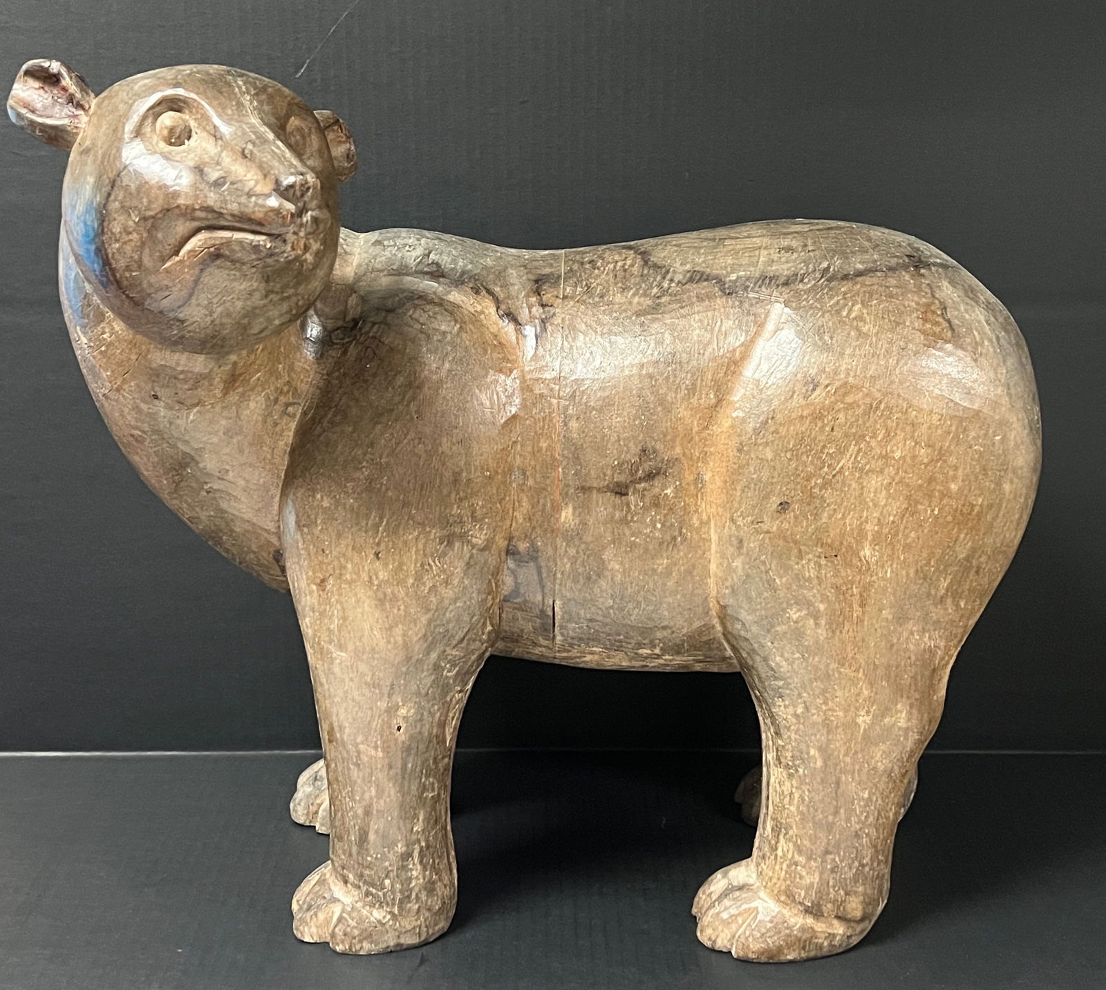 Large Polar Bear Sculpture: Folk Art Carved Wood Large Polar Bear Sculpture. The dimension is 18.5 inches high x 19 inches wide x 13 inches depth. Please be aware that some of the items are vintage, secondhand, old ages,