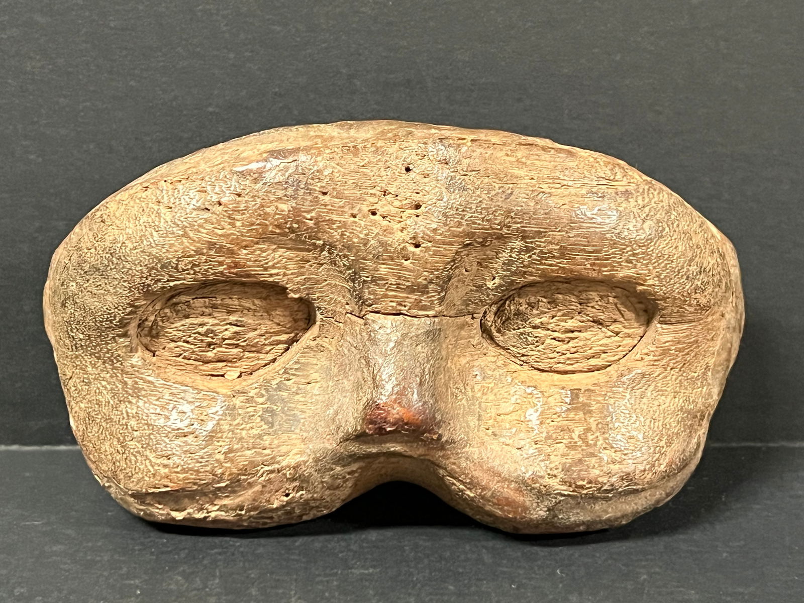 Carved Wood Masquerade Mask: Folk Art Carved Wood Masquerade Mask. The dimension is 3 inches high x 2.25 inches depth x 6.5 inches wide. Please be aware that some of the items are vintage, secondhand, old ages, antiques and may