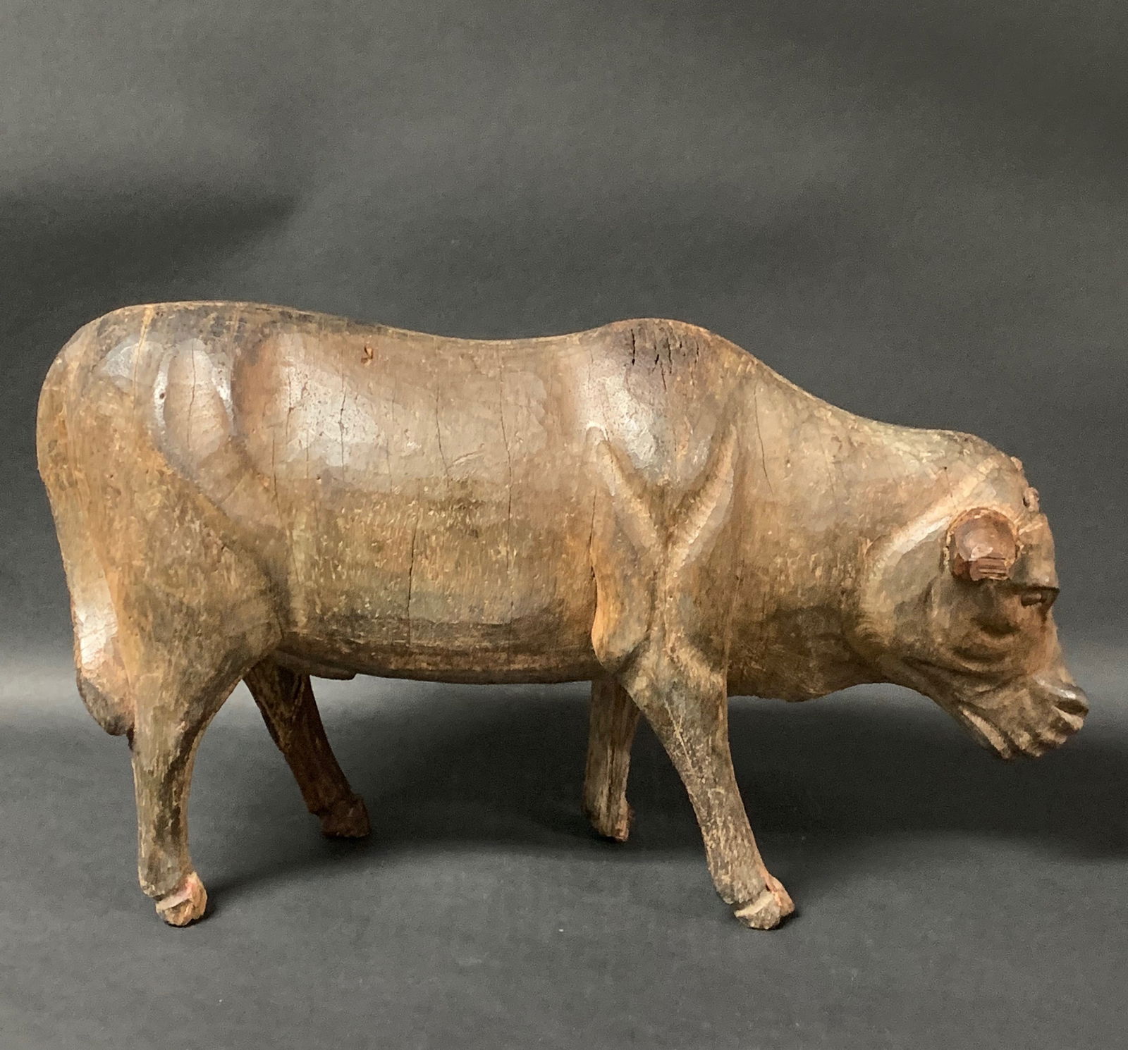 Large Cow Sculpture: Folk Art Carved Wood Large Cow Sculpture. The dimension is 9.5 inches high x 16 inches wide. Please be aware that some of the items are vintage, secondhand, old ages, antiques and may have a defects