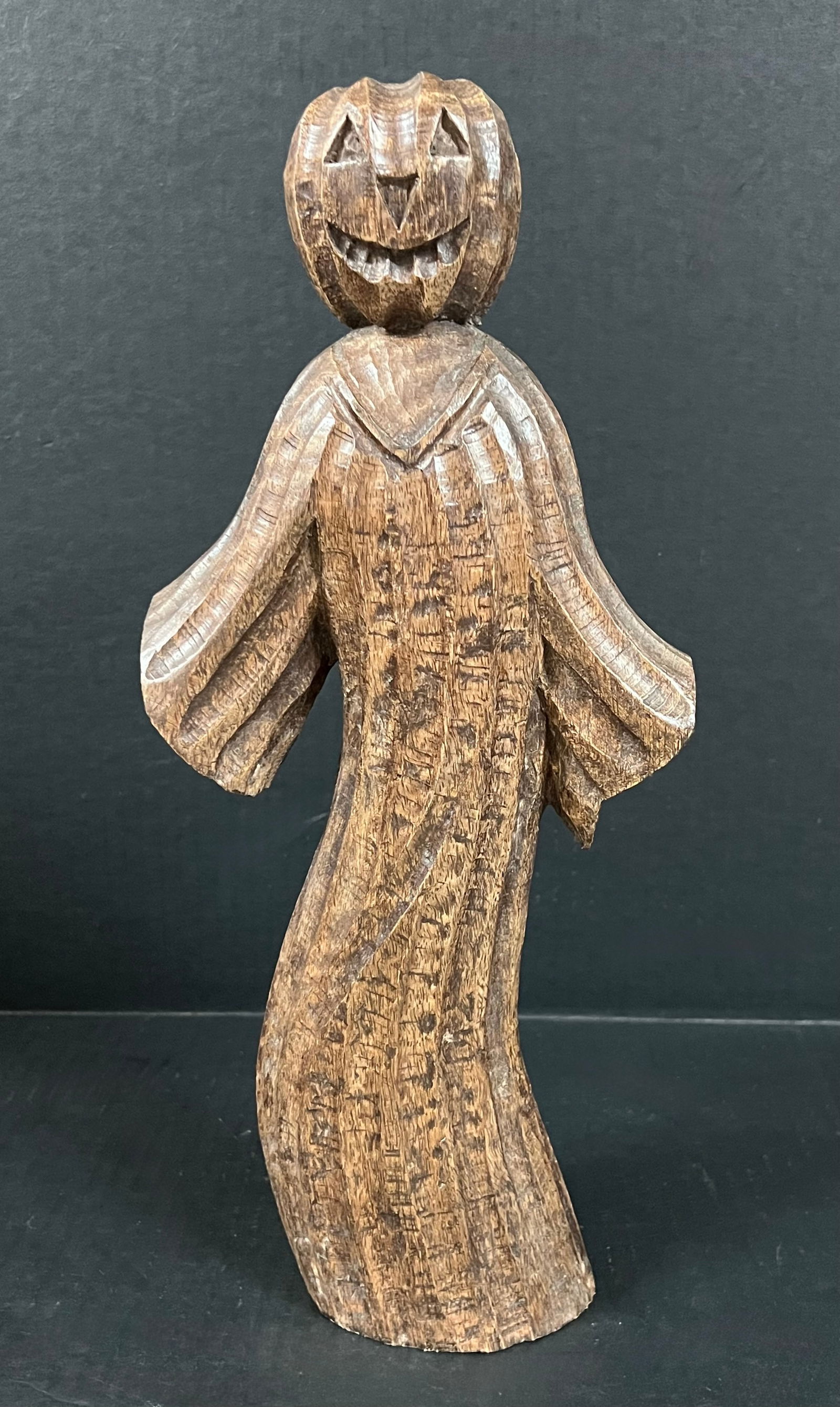 Carved Wood Ghost with Jack O Lantern Pumpkin Head Sculpture: Folk Art Carved Wood Ghost with Jack O Lantern Pumpkin Head Sculpture. The dimension is 14.5 inches high x 2.5 inches depth x 6 inches wide. Please be aware that some of the items are vintage,