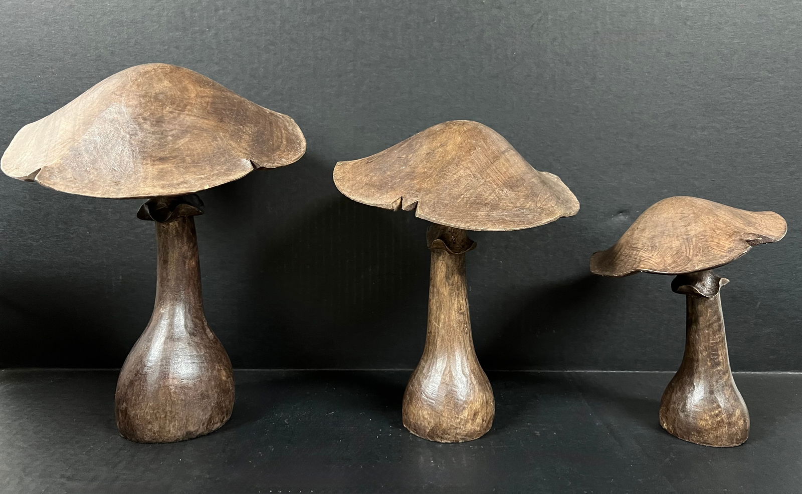 Set of Carved Wood Mushroom: Folk Art Carved Wood Set of Mushroom. The dimension is 8 inches high x 6 inches wide, 10 inches high x 8 inches wide and 12 inches high x 9 inches wide. Please be aware that some of the items are
